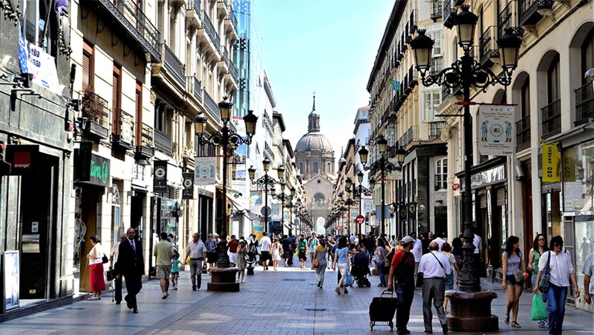 an abstract photo of a curved building with a blue sky in the background
