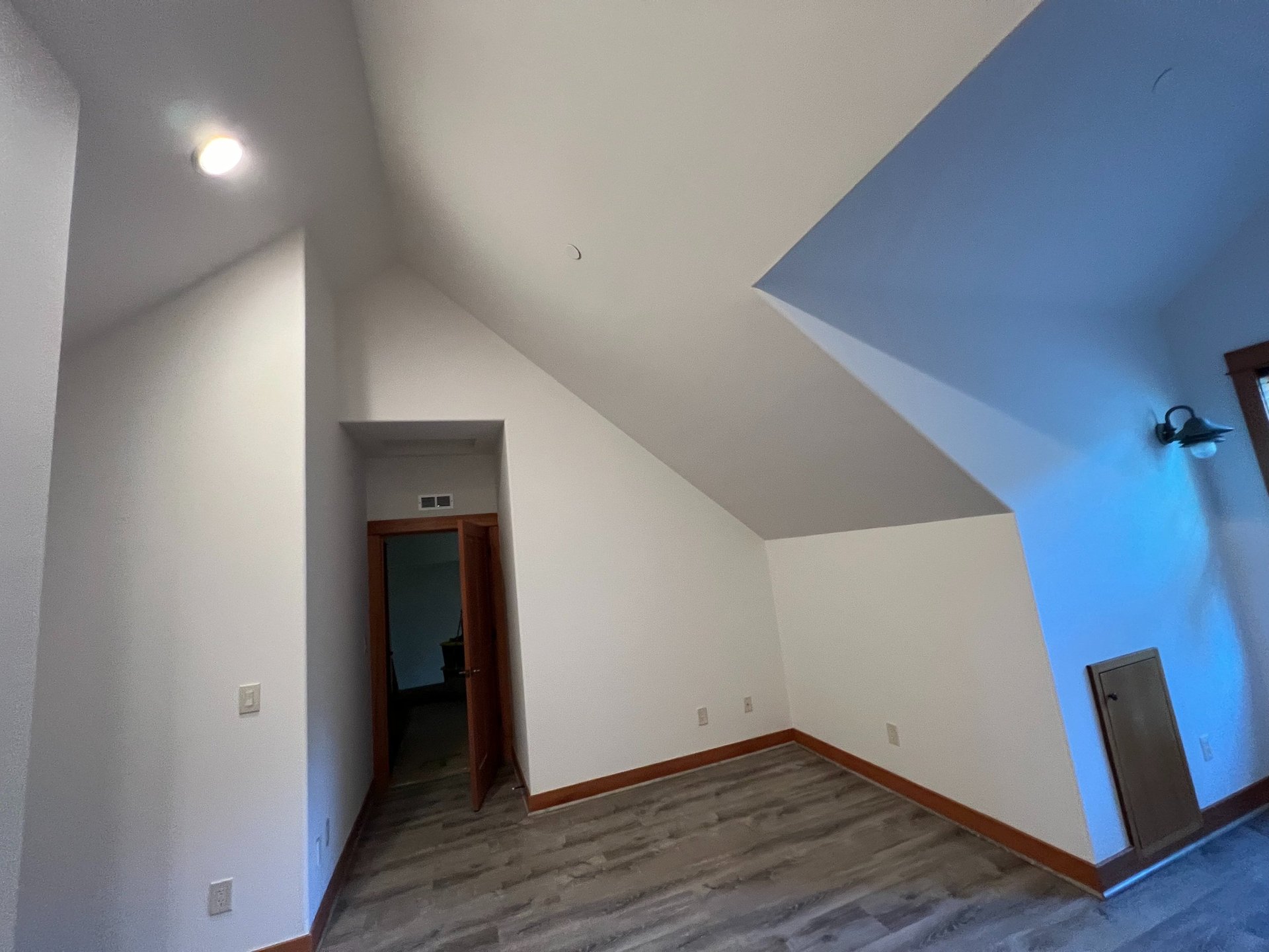 brown wooden framed blue padded armchair