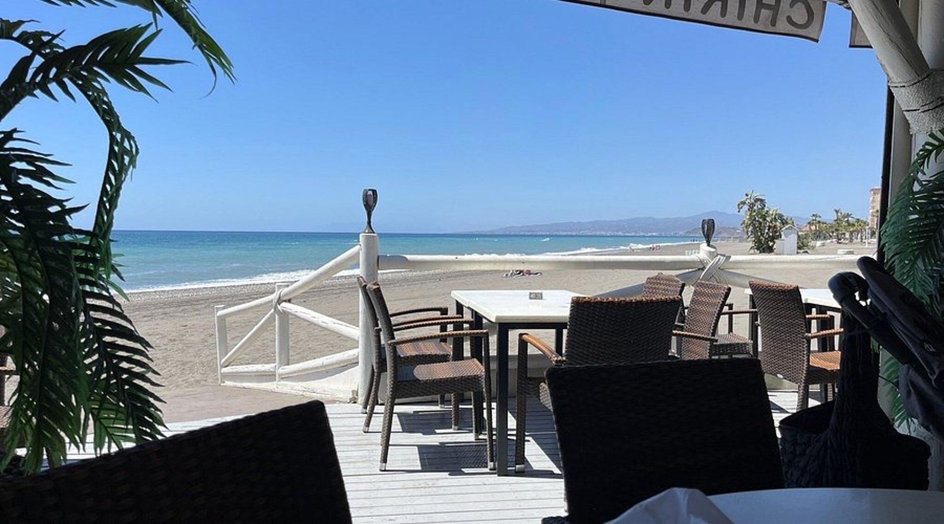 an abstract photo of a curved building with a blue sky in the background