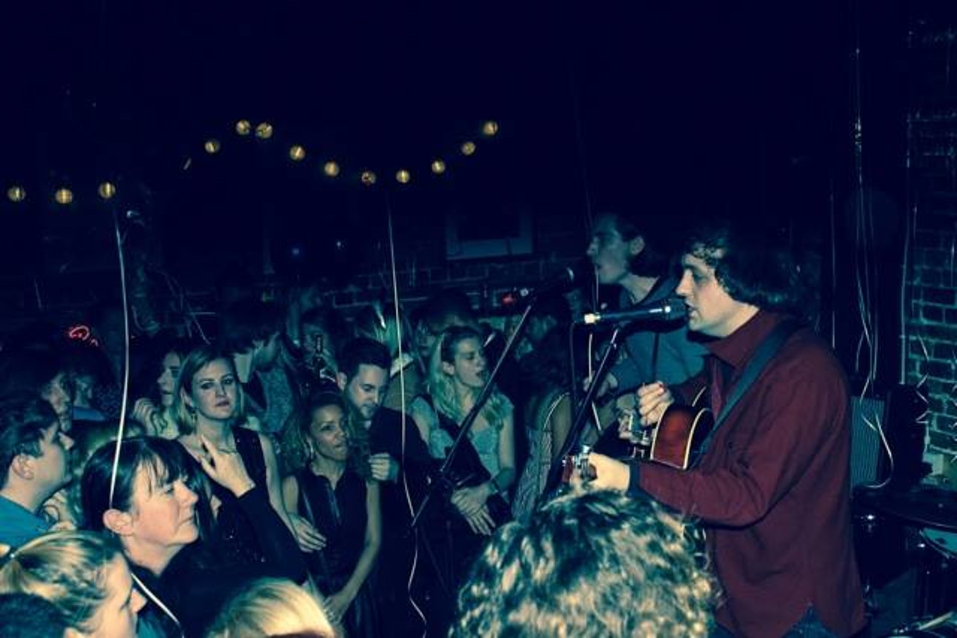 black and brown leather padded tub sofa