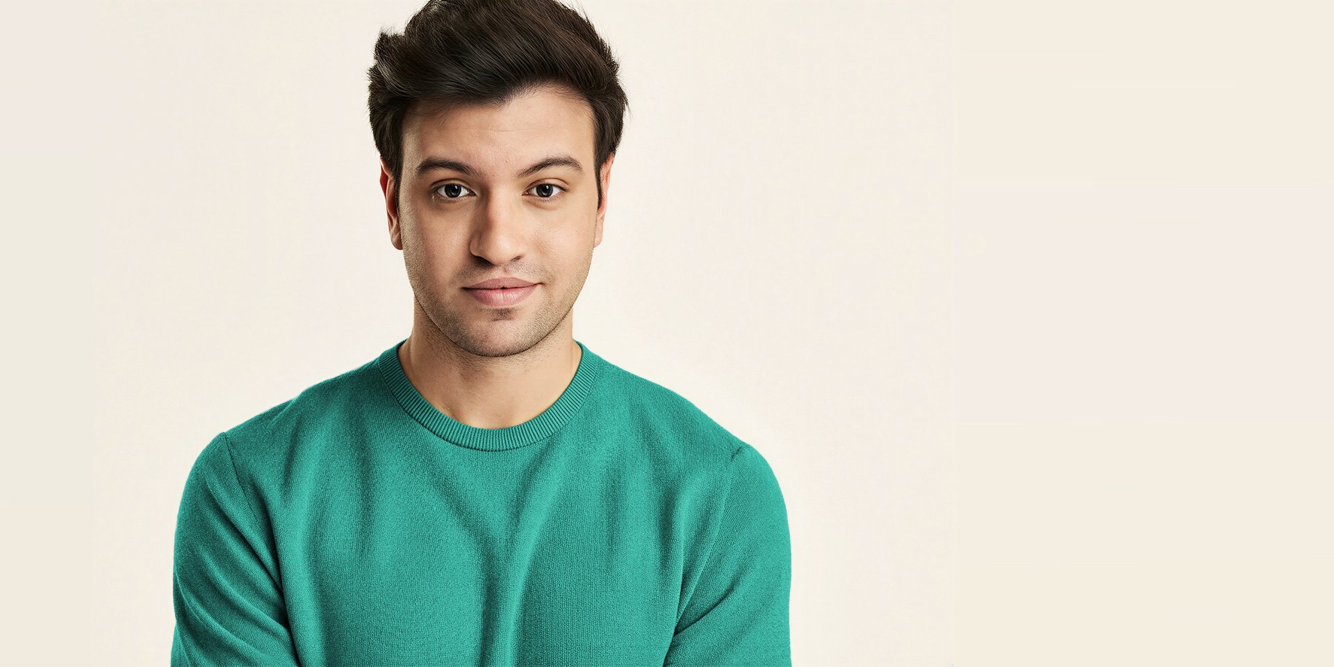 A close up of a green object on a black background