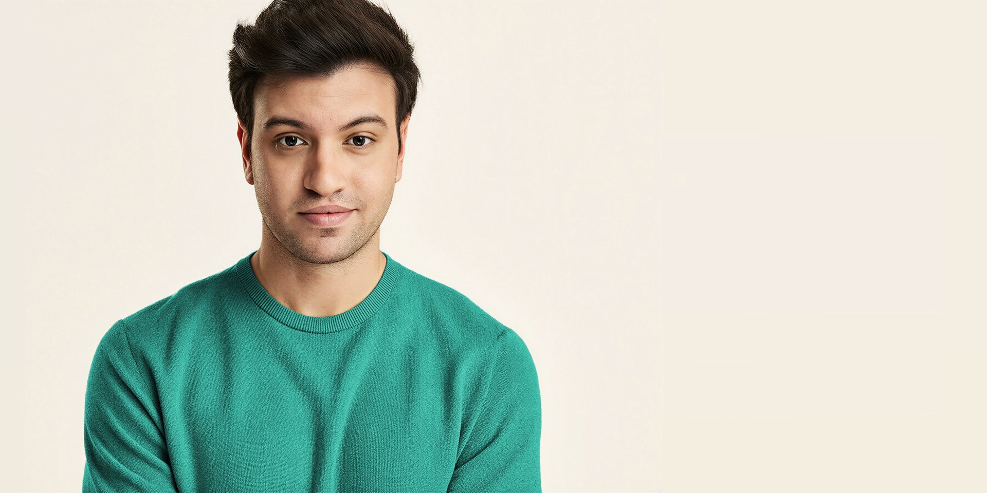 A close up of a green object on a black background