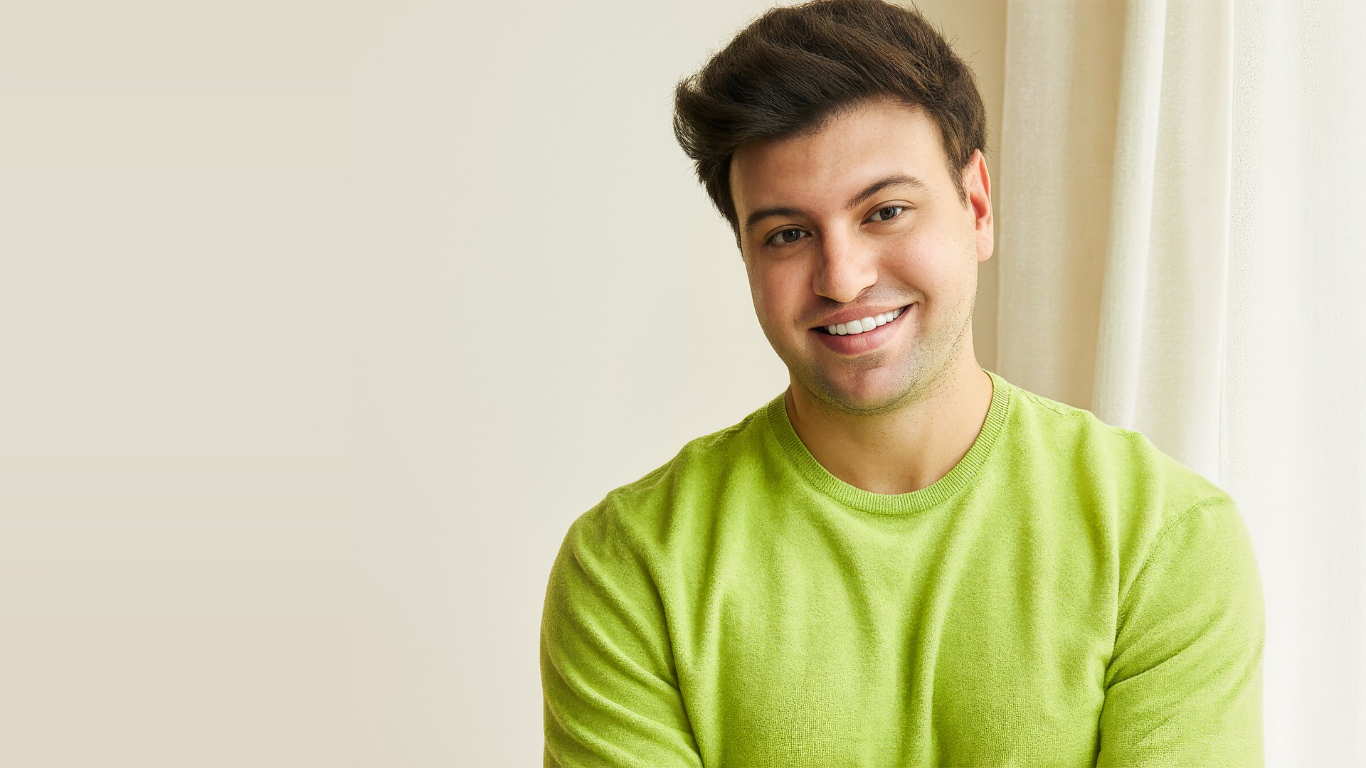 A close up of a green object on a black background