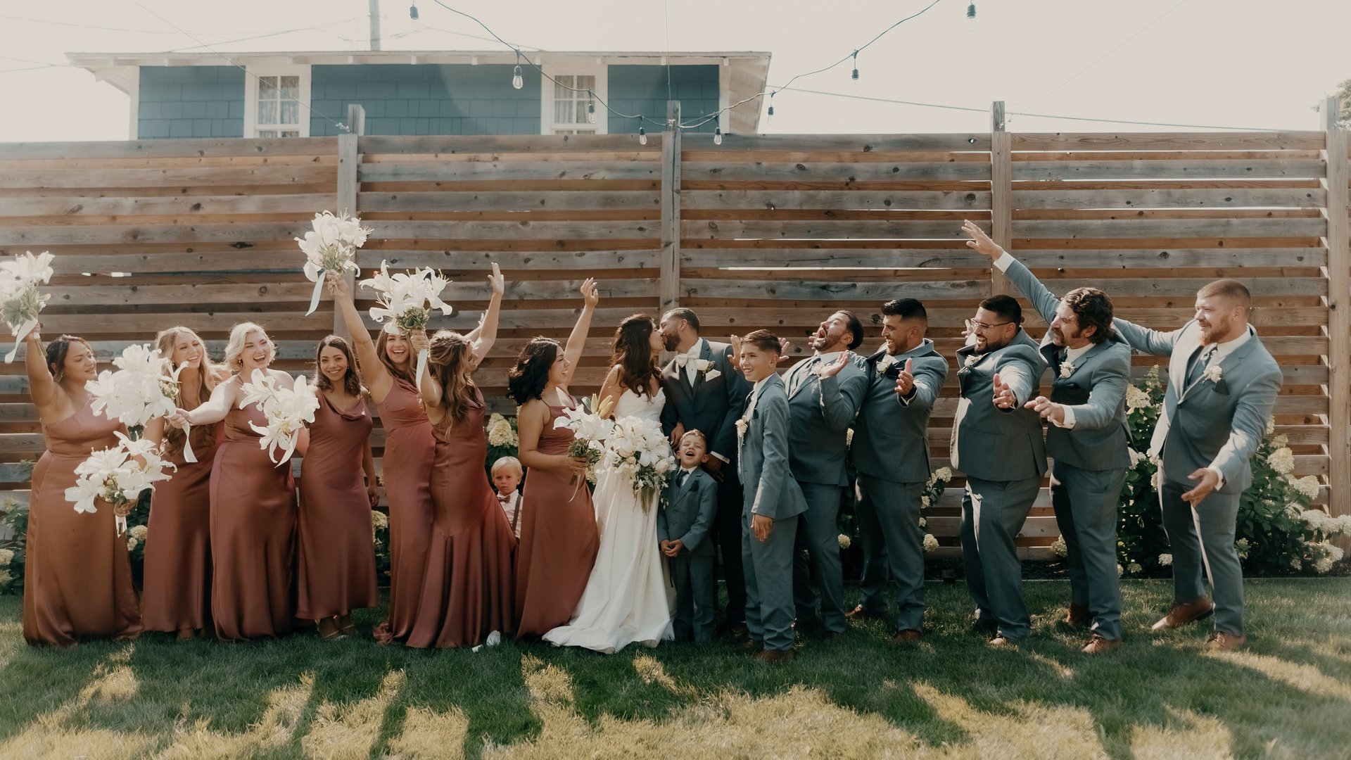Bride with bridesmaids in matching robes and sunglasses celebrating with champagne before the wedding – captured by Anngye &