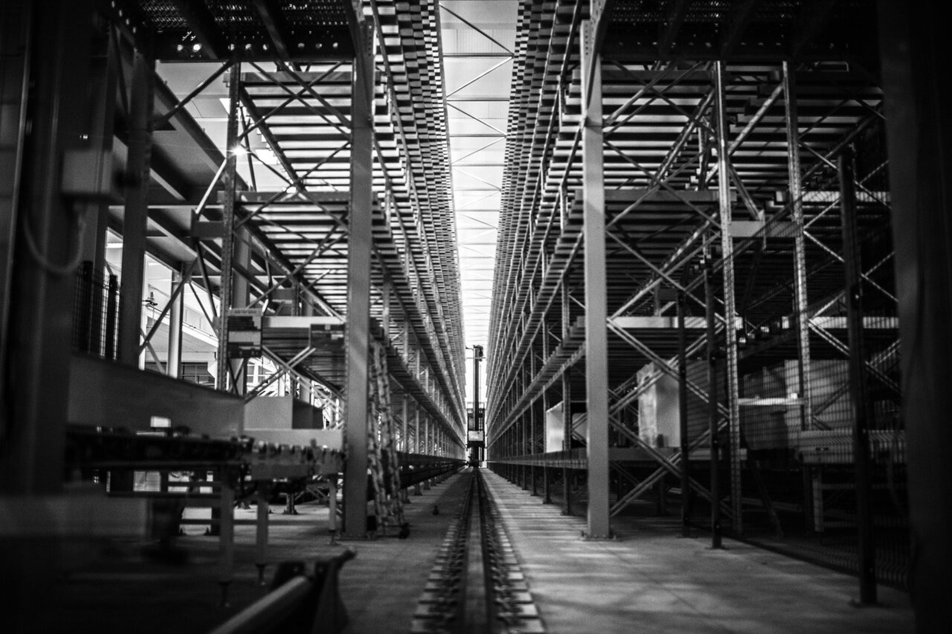 an abstract photo of a curved building with a blue sky in the background