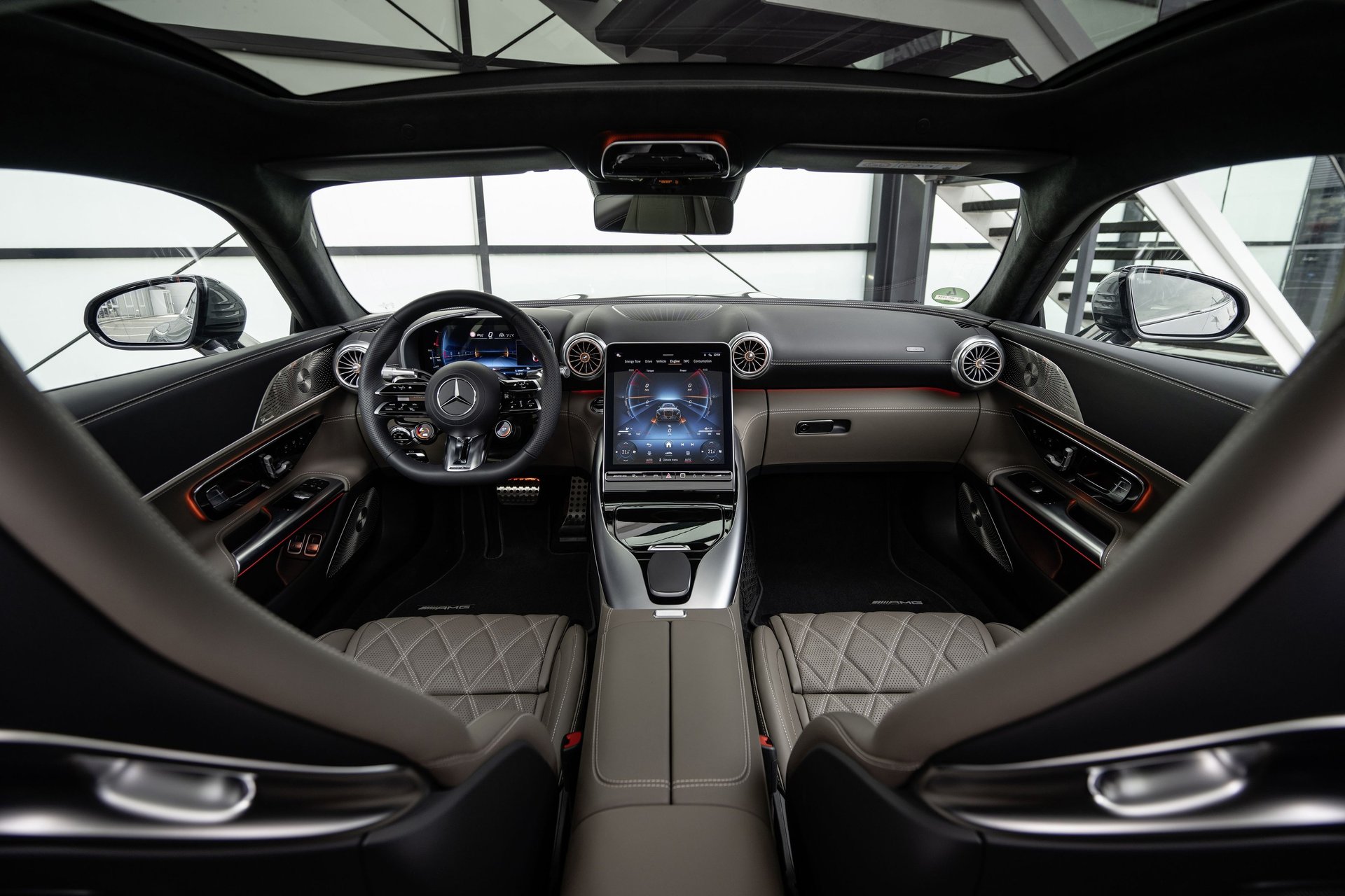 an abstract photo of a curved building with a blue sky in the background