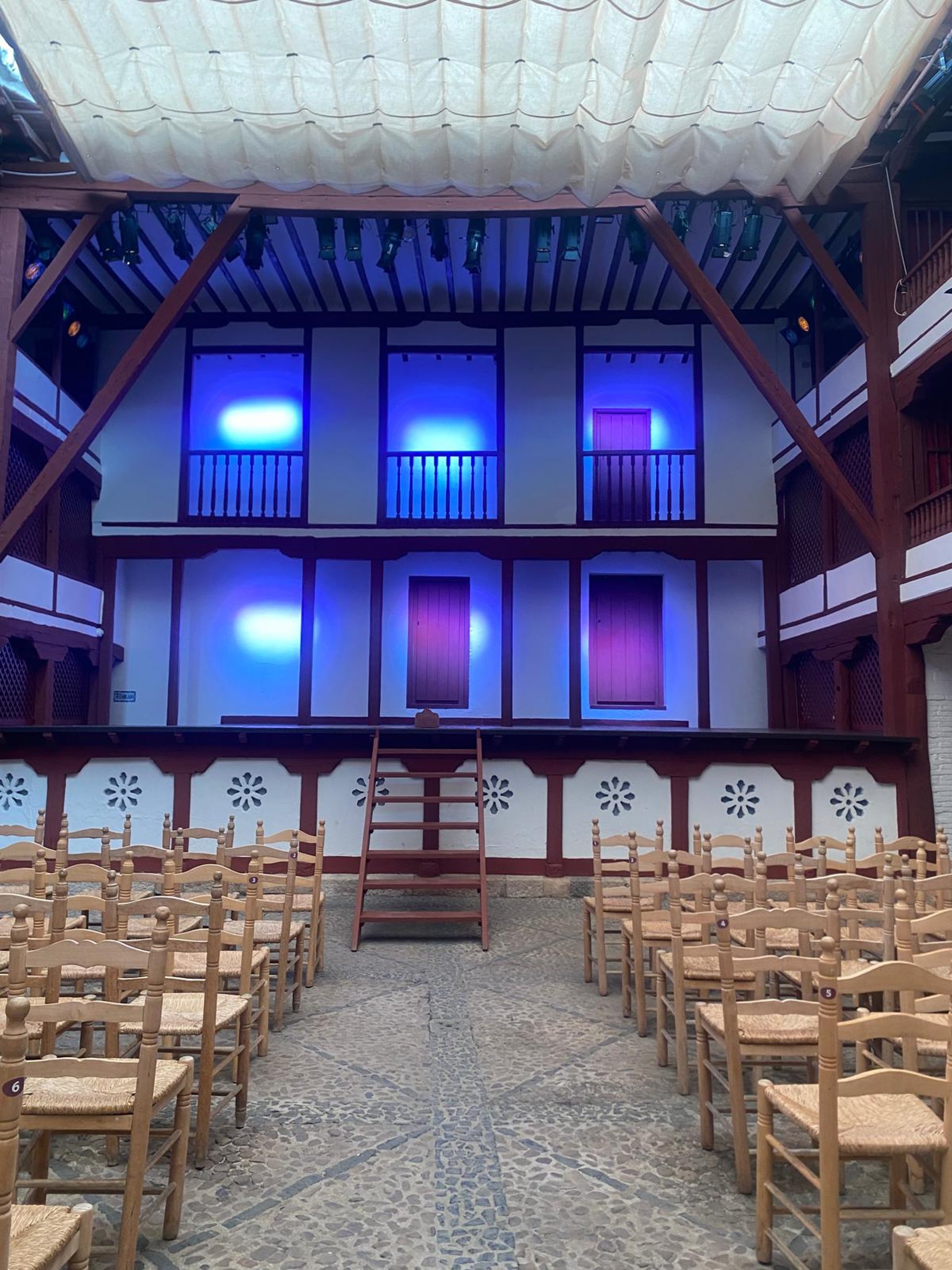 an abstract photo of a curved building with a blue sky in the background