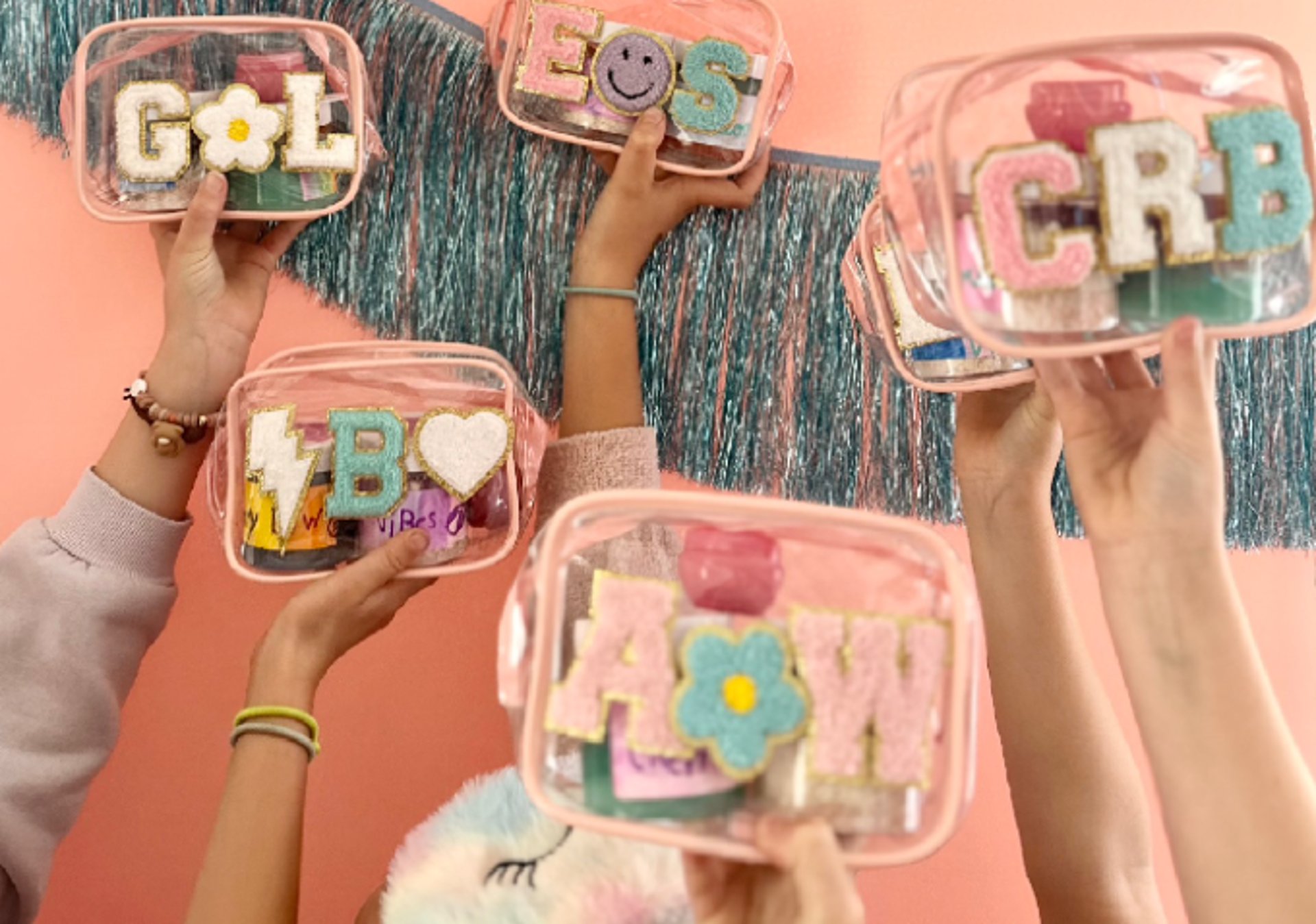 a person painting a pink wall with yellow paint