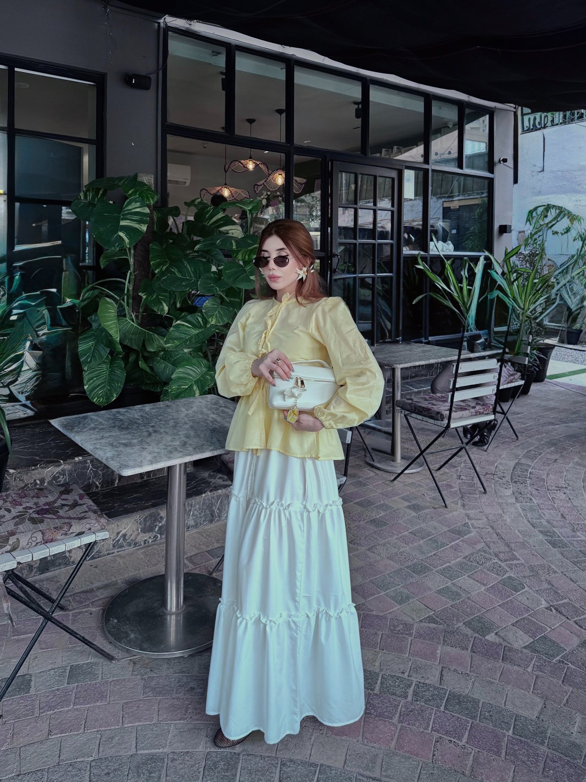 woman holding dried flower