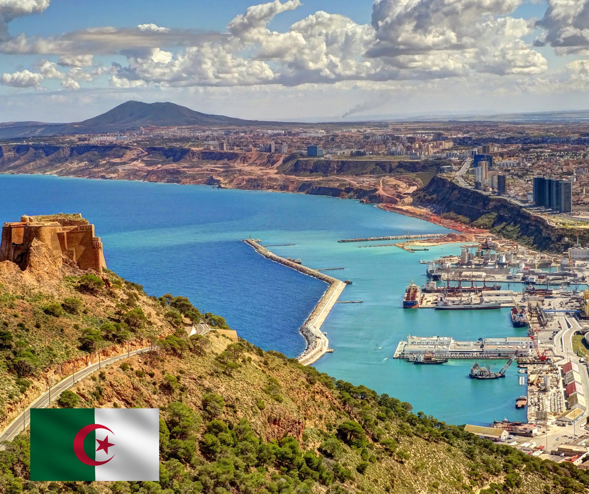 a large building with a statue in the middle