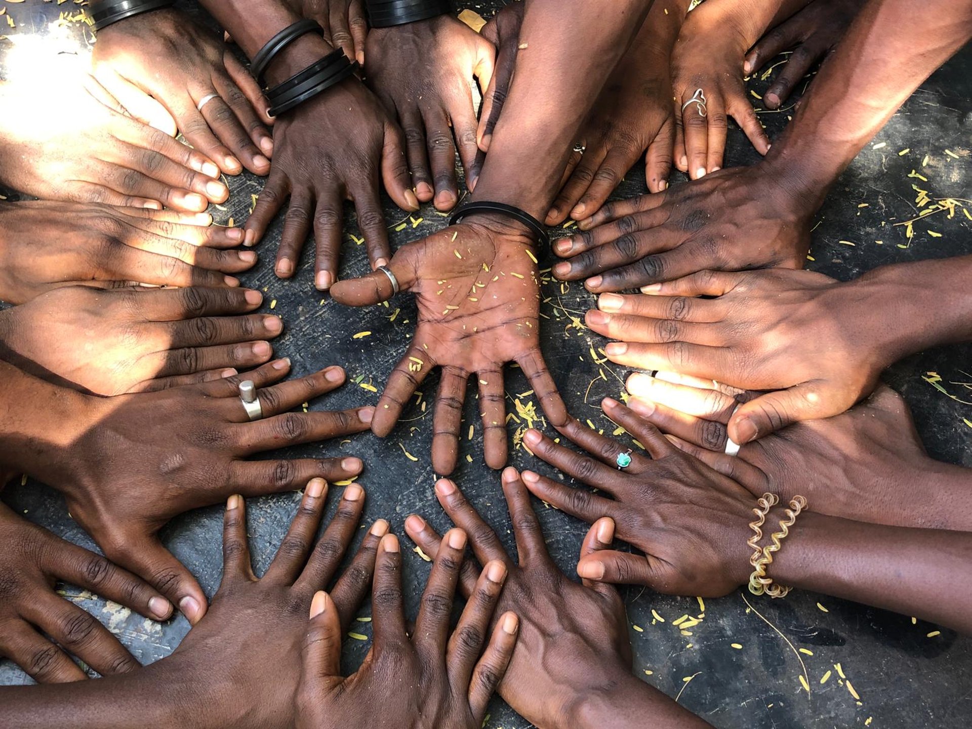 woman wearing yellow long-sleeved dress under white clouds and blue sky during daytime