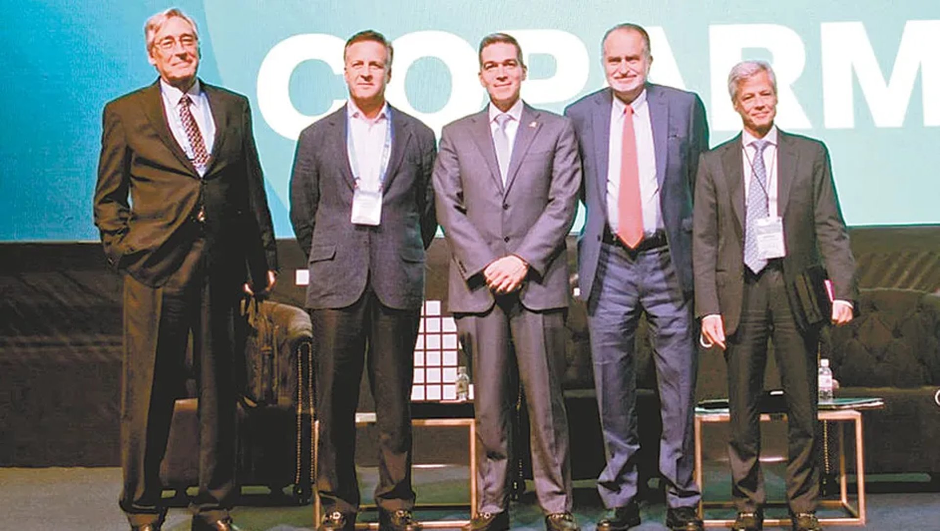 four brown camels under blue sky