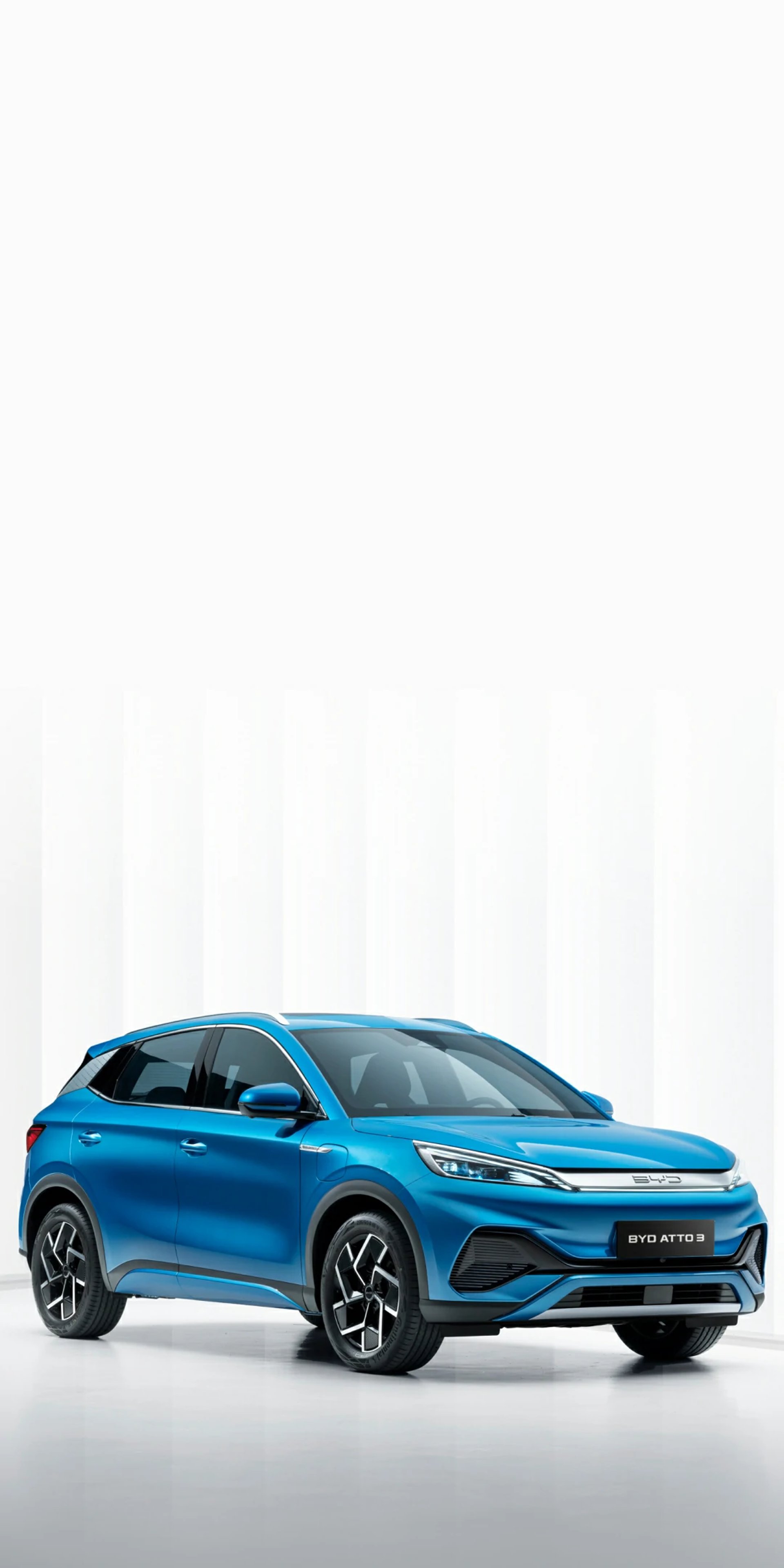 an abstract photo of a curved building with a blue sky in the background