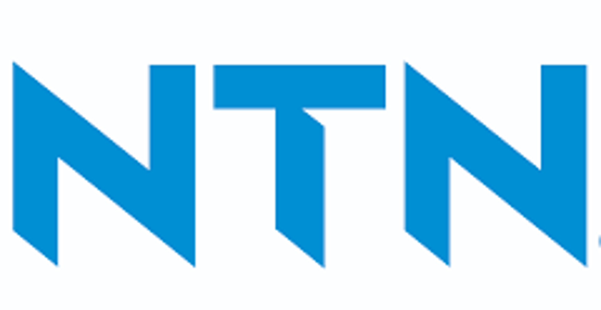 an abstract photo of a curved building with a blue sky in the background