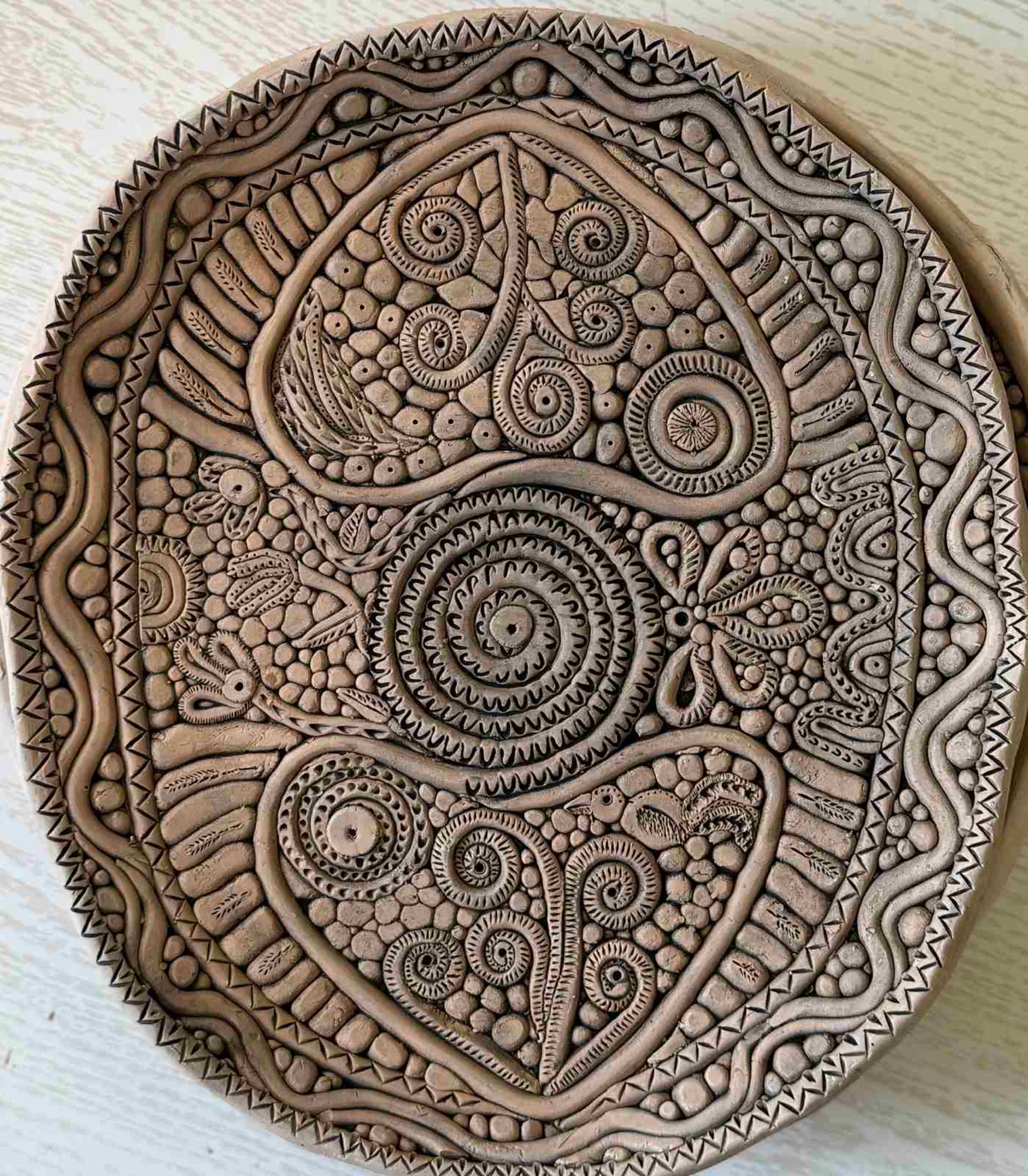 an abstract photo of a curved building with a blue sky in the background