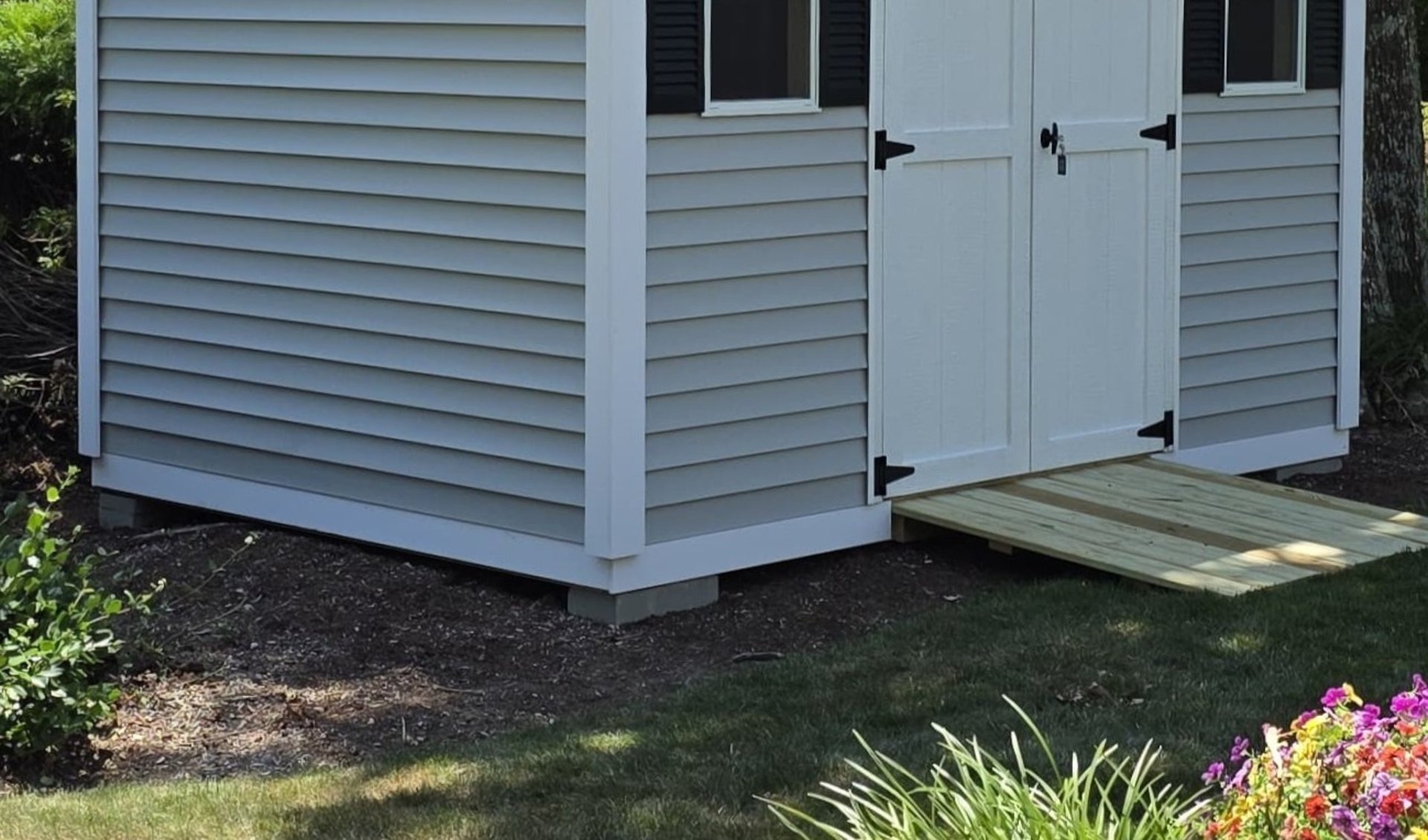 Decorative frieze bottom trim on custom shed built in Massachusetts, enhancing shed appearance with elegant finishing detail.