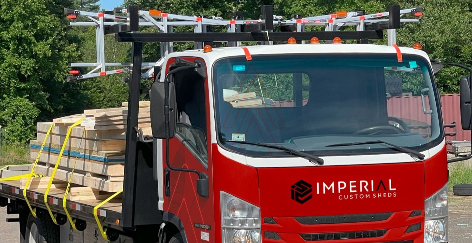 Imperial Custom Sheds delivery truck on the way to on-site shed installation