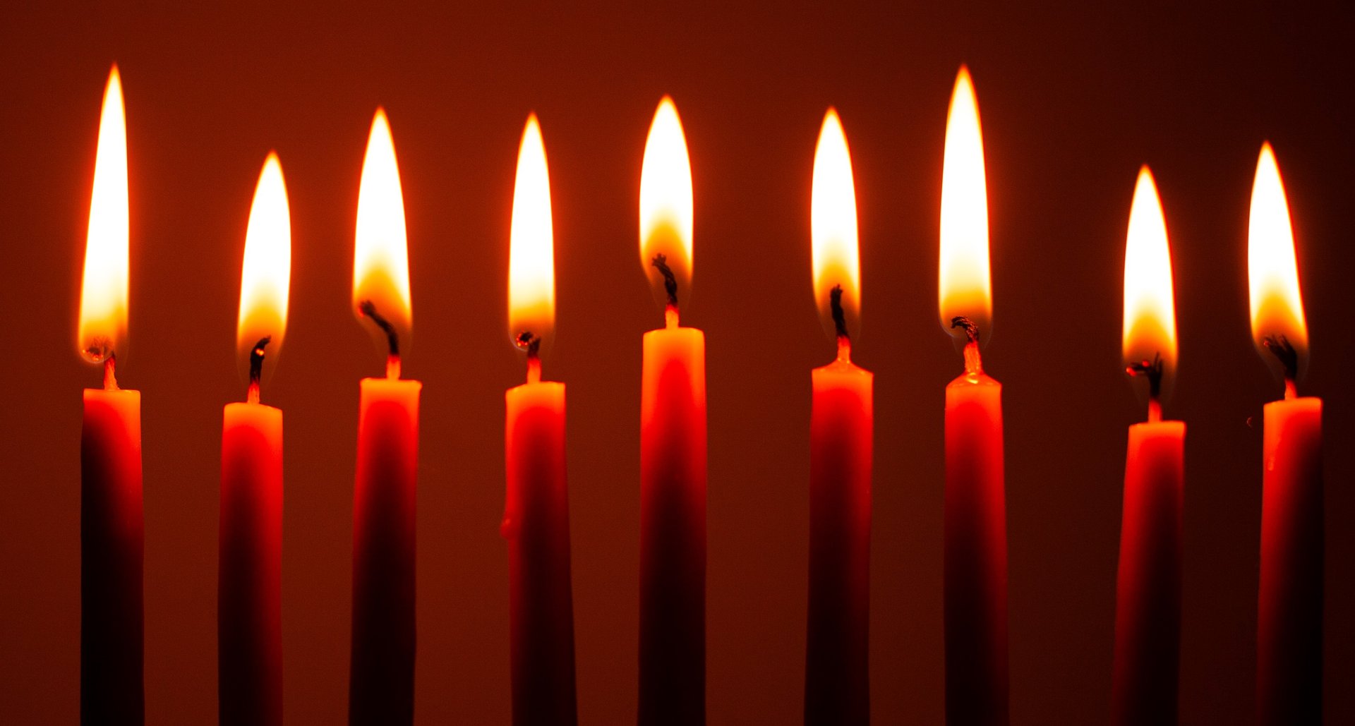 an abstract photo of a curved building with a blue sky in the background