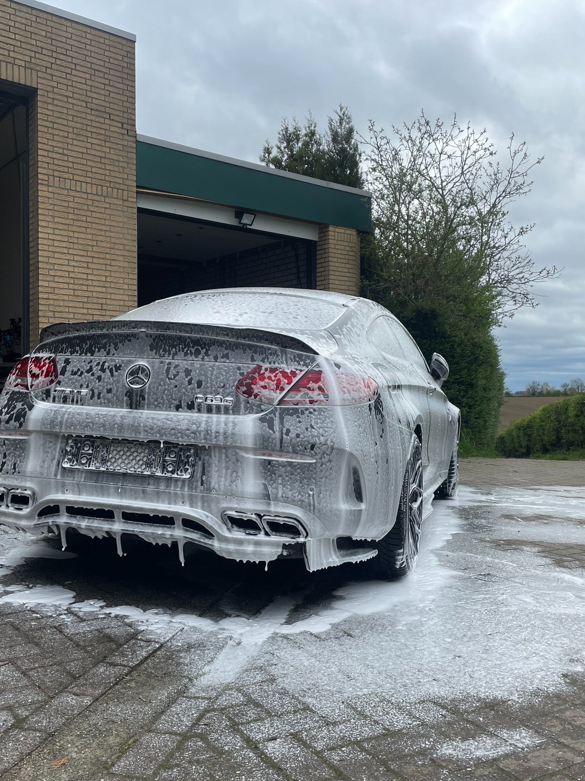 black and brown leather padded tub sofa