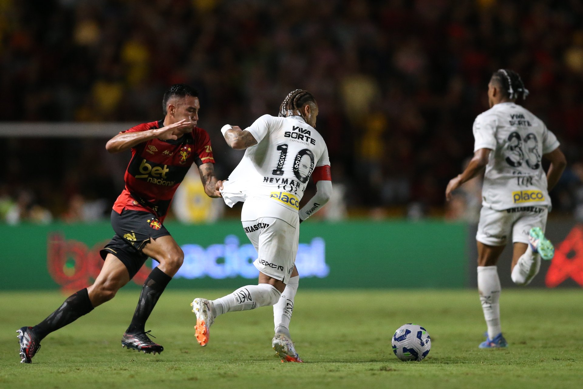 man playing soccer game on field