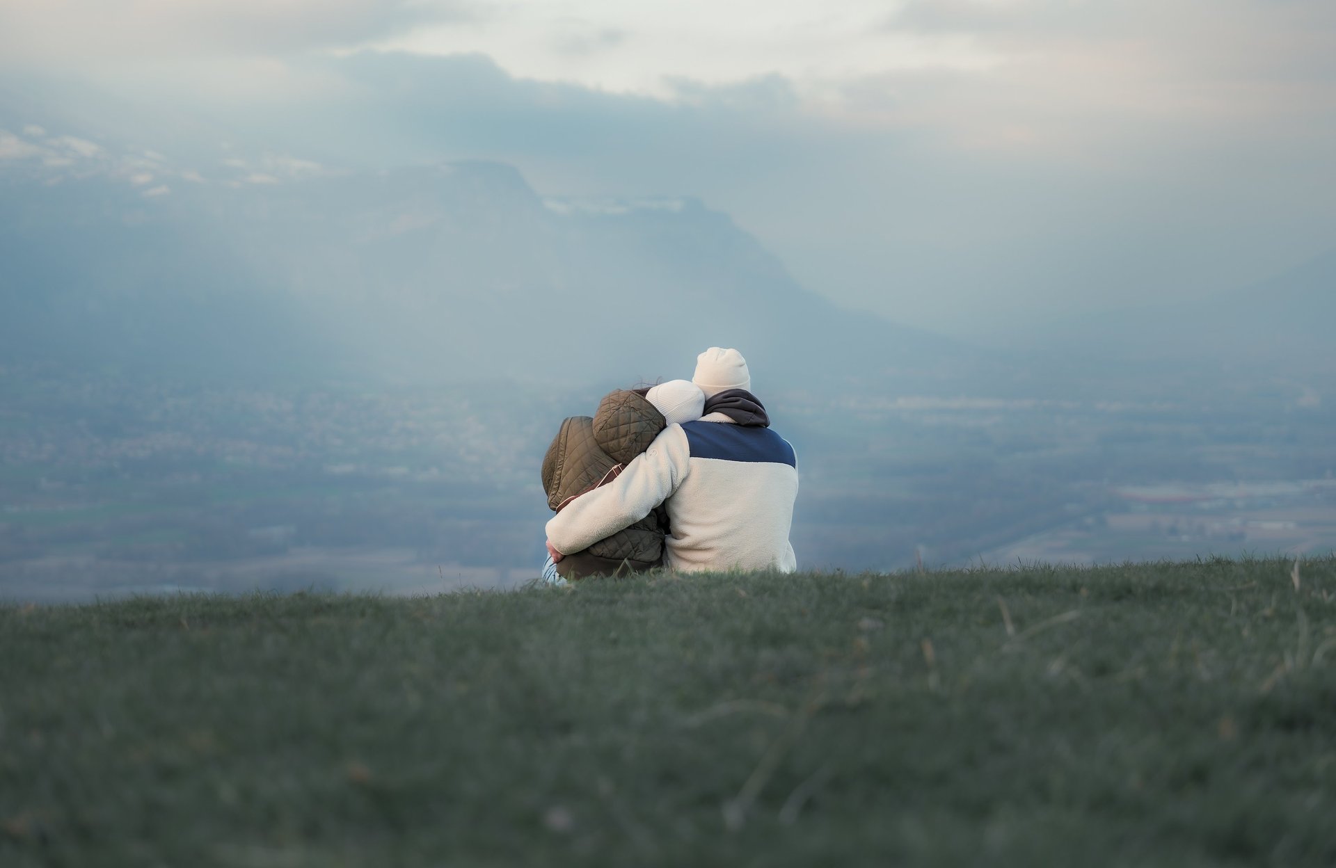 an abstract photo of a curved building with a blue sky in the background