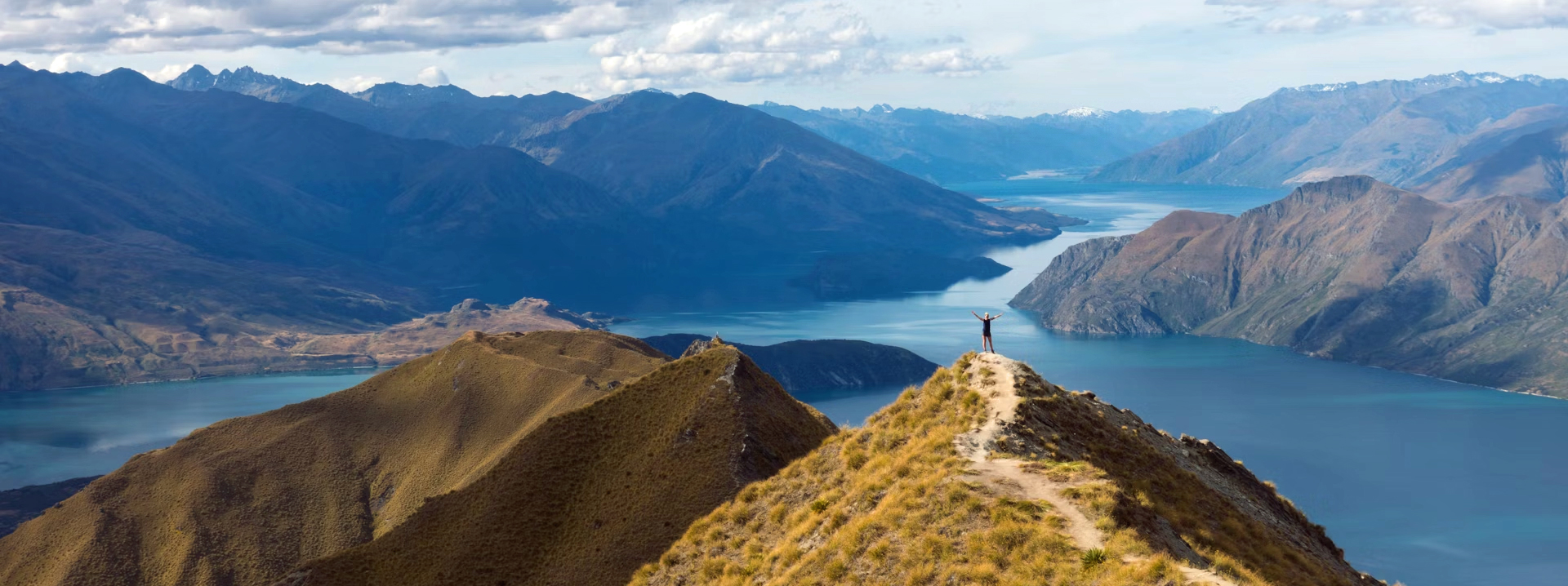 person at the peak of the mountain