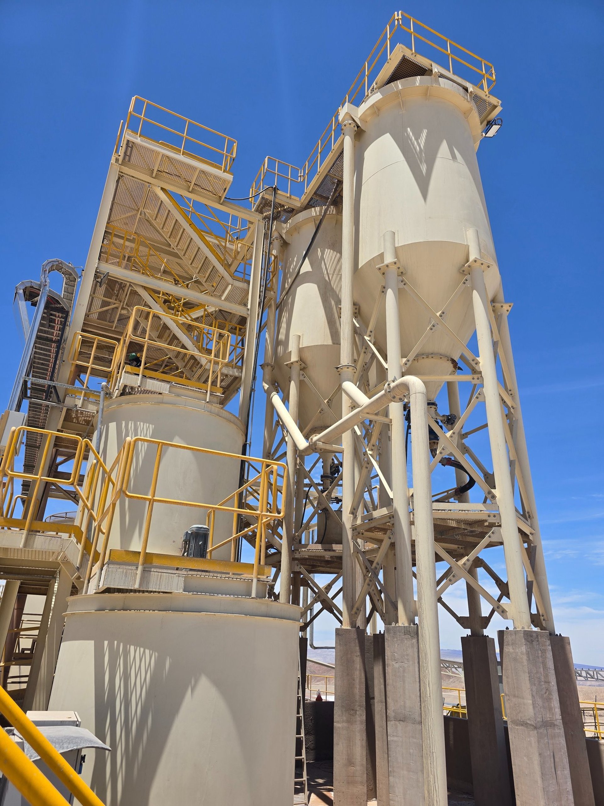 woman wearing yellow long-sleeved dress under white clouds and blue sky during daytime