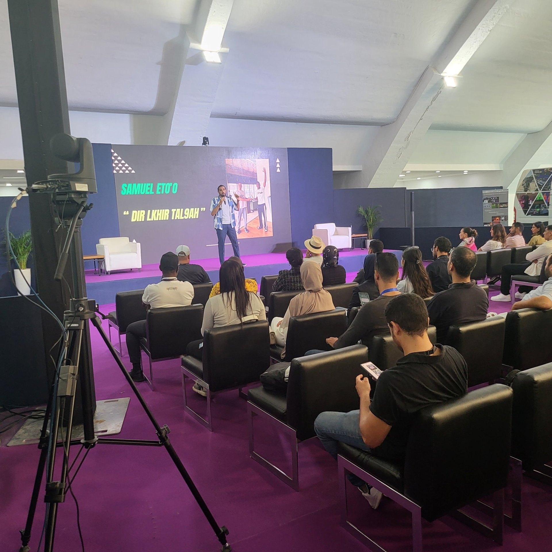 an abstract photo of a curved building with a blue sky in the background