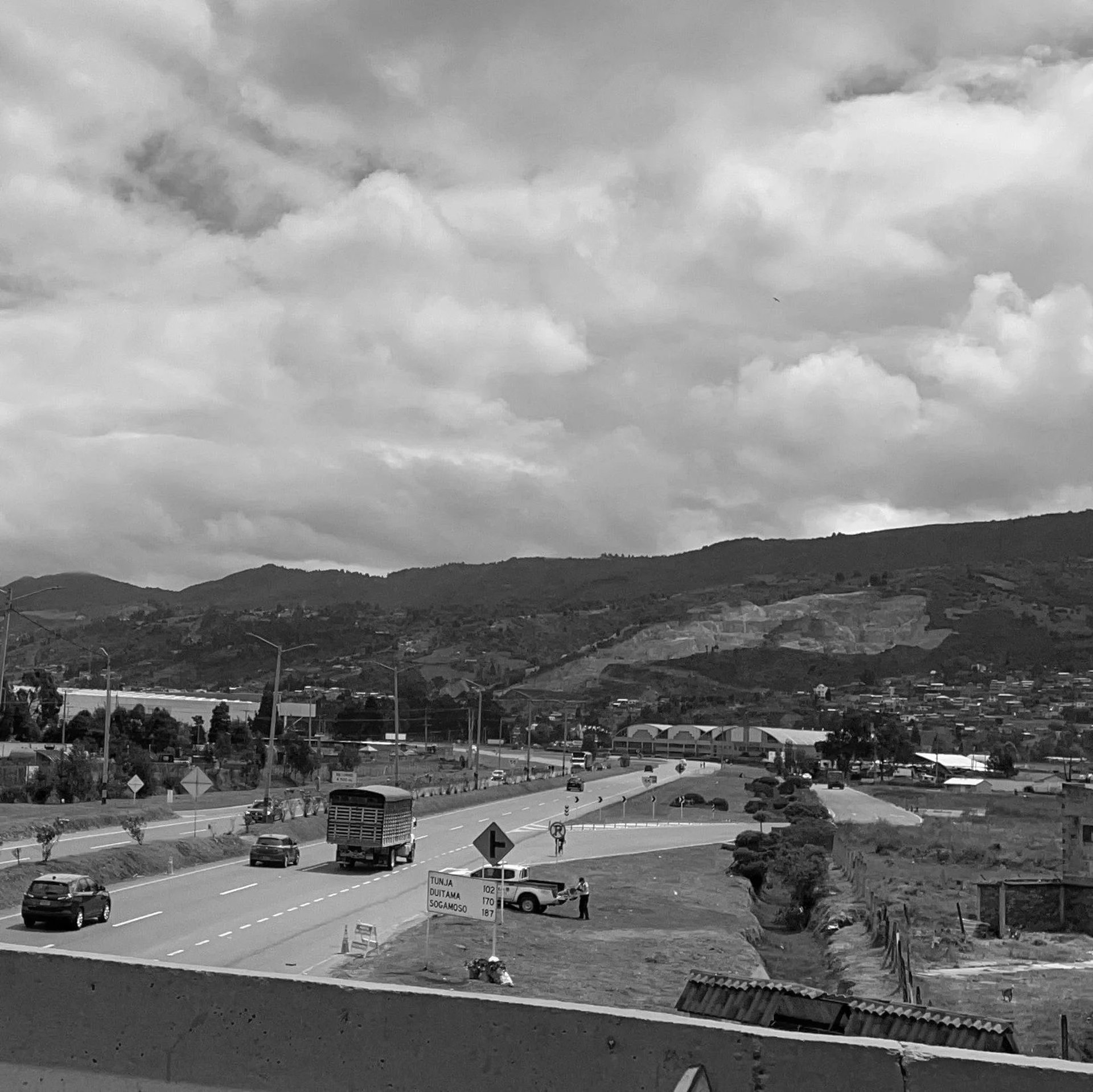 woman wearing yellow long-sleeved dress under white clouds and blue sky during daytime