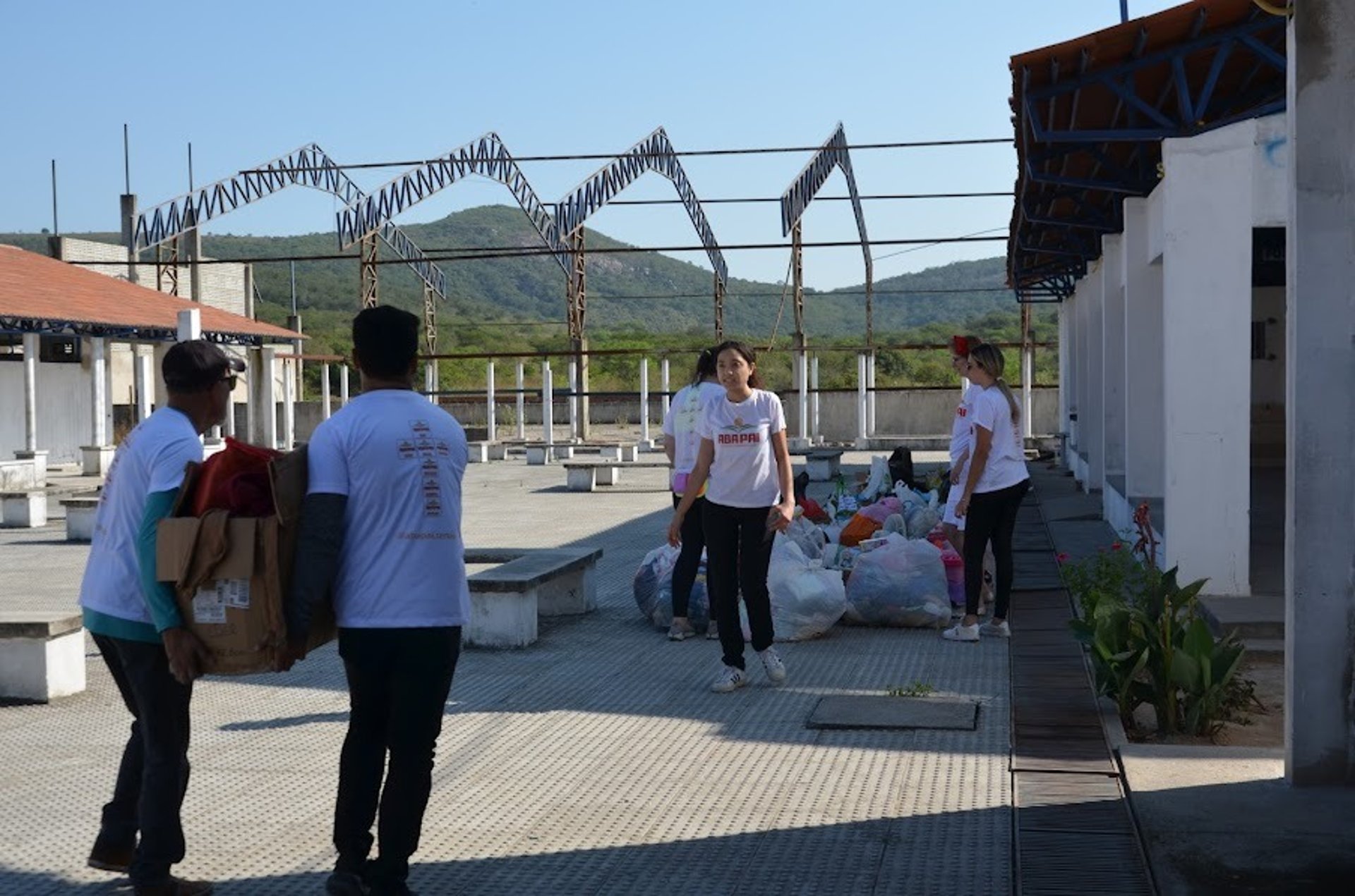 woman wearing yellow long-sleeved dress under white clouds and blue sky during daytime