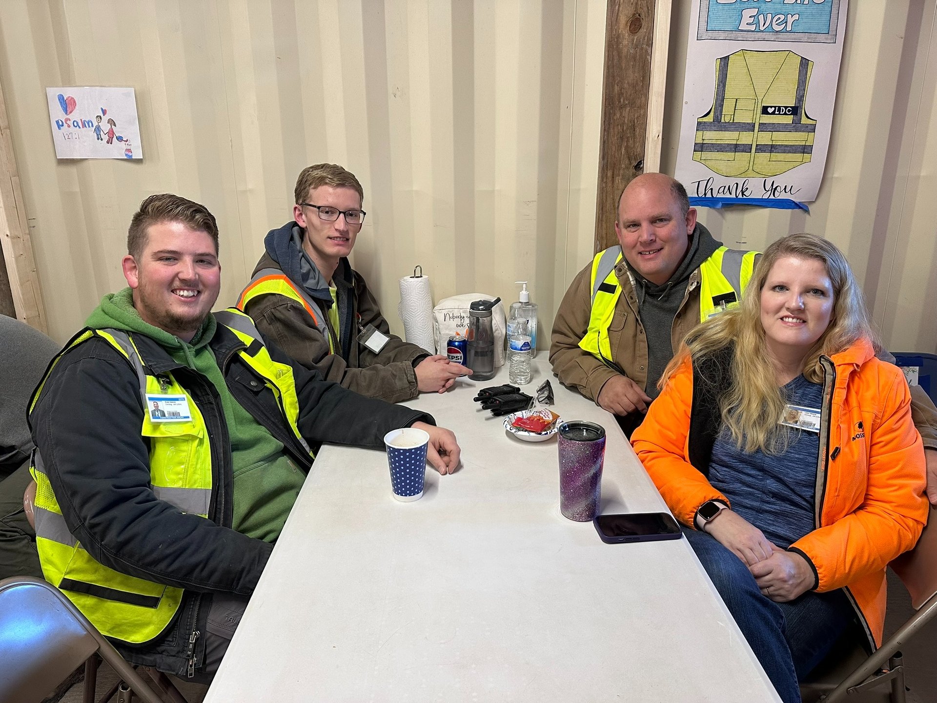 Power Plus Electric & HVAC crew members on-site during a break, showcasing team culture and jobsite safety in Poplar Bluff, M