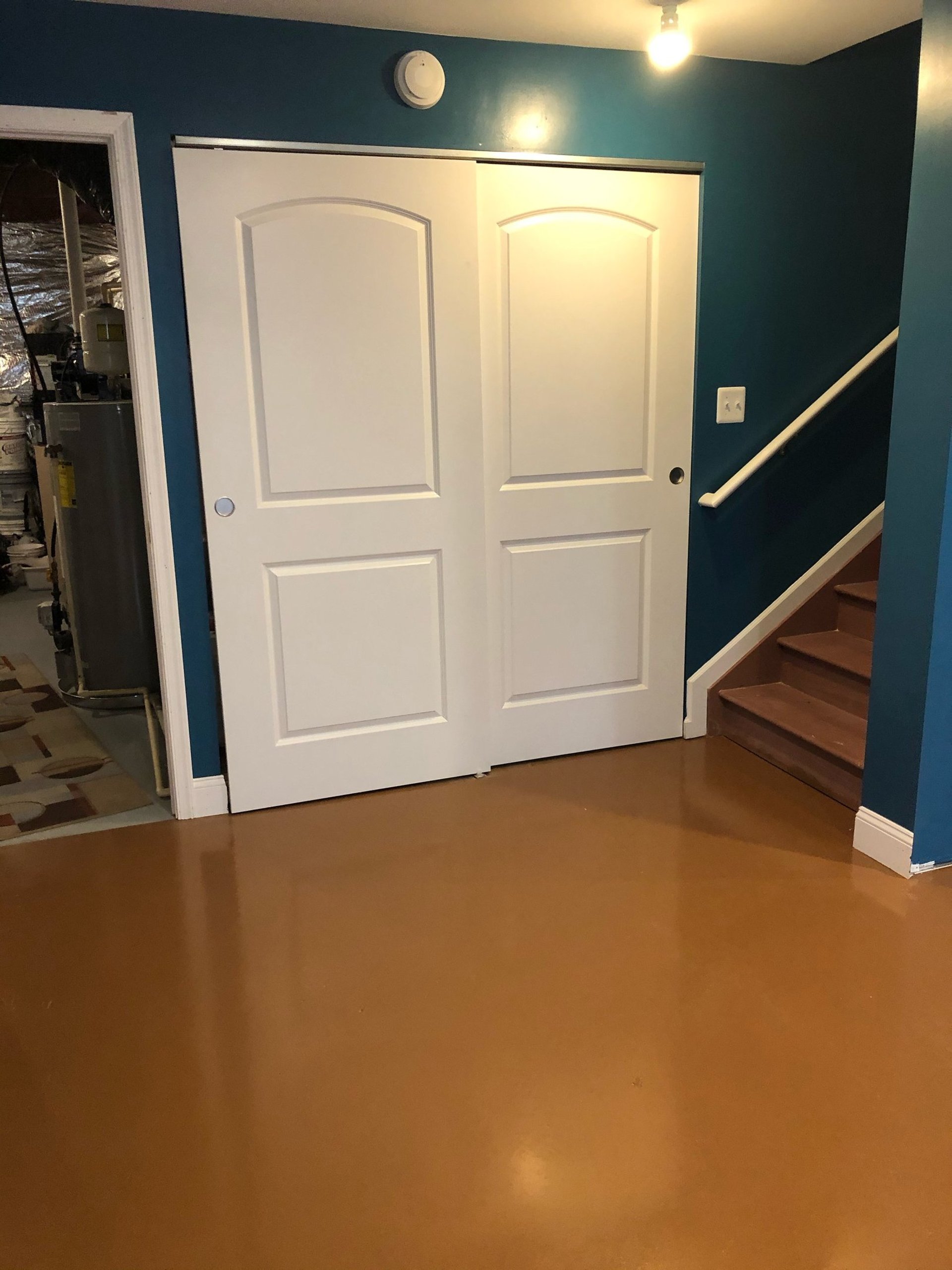 an abstract photo of a curved building with a blue sky in the background