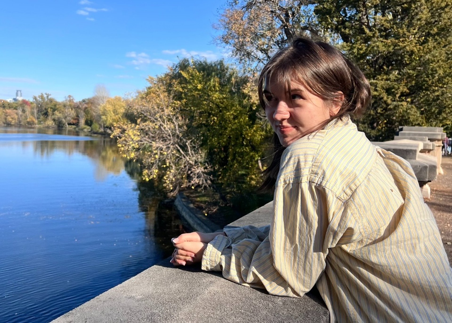 an abstract photo of a curved building with a blue sky in the background