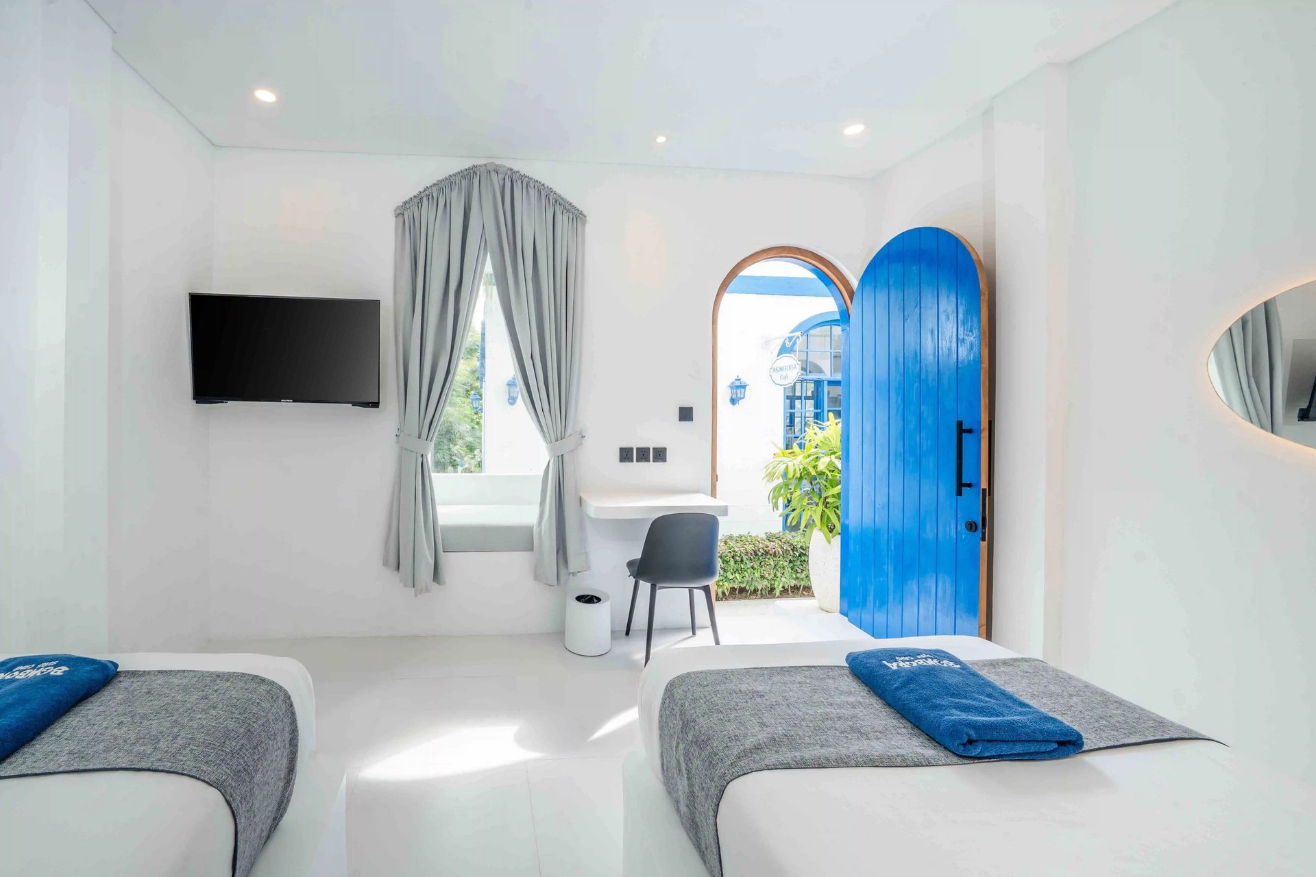 an abstract photo of a curved building with a blue sky in the background