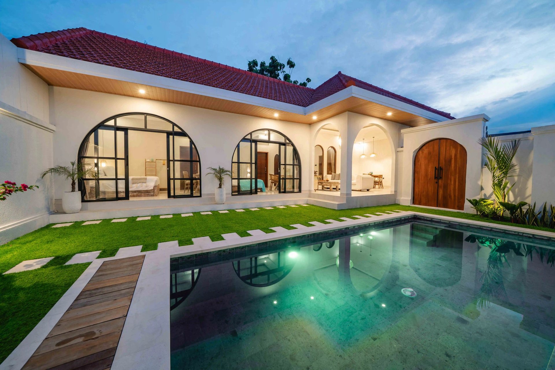 an abstract photo of a curved building with a blue sky in the background