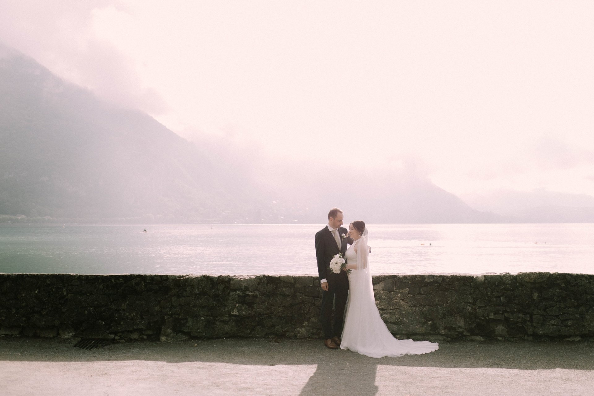 an abstract photo of a curved building with a blue sky in the background