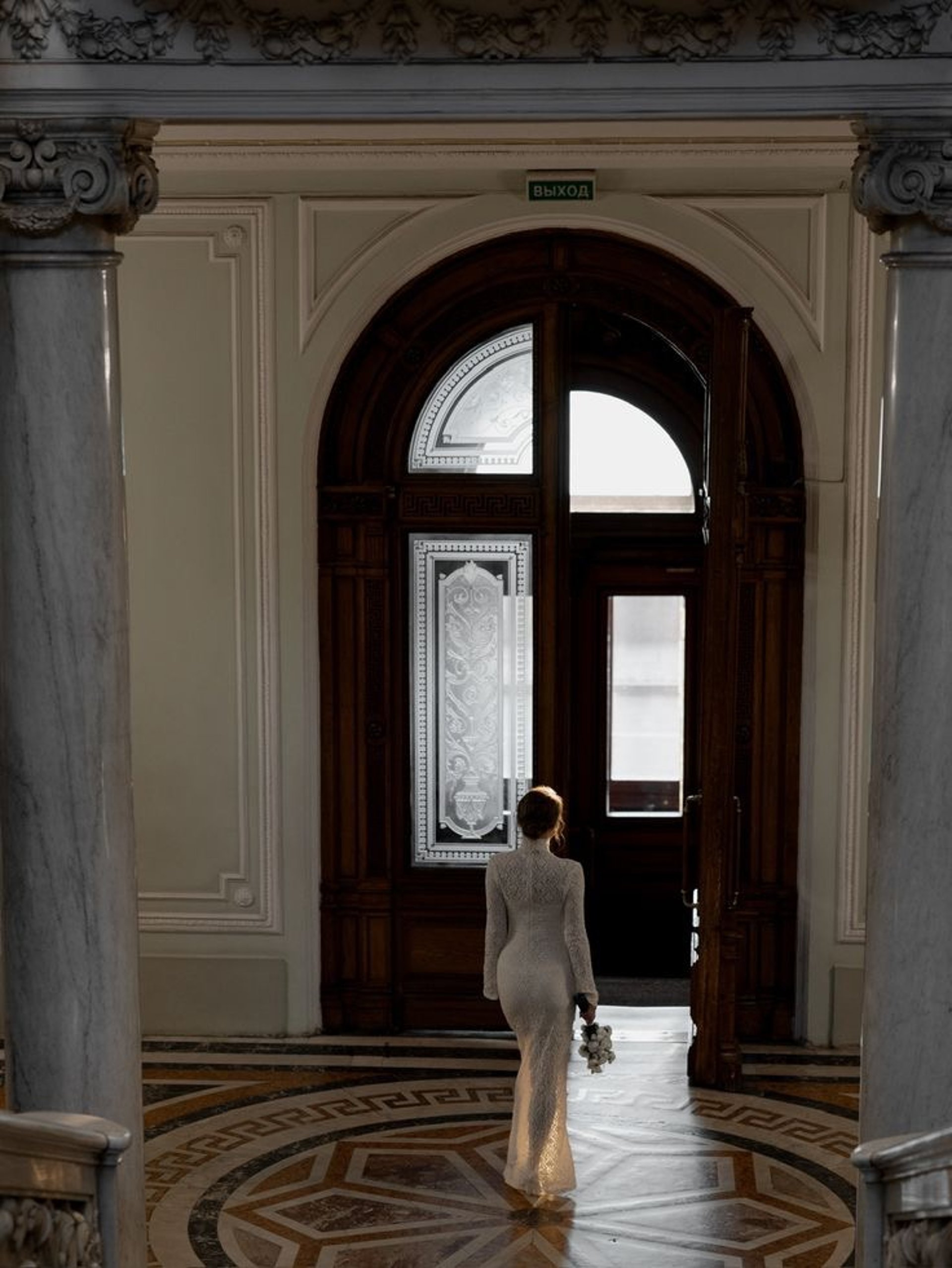 an abstract photo of a curved building with a blue sky in the background