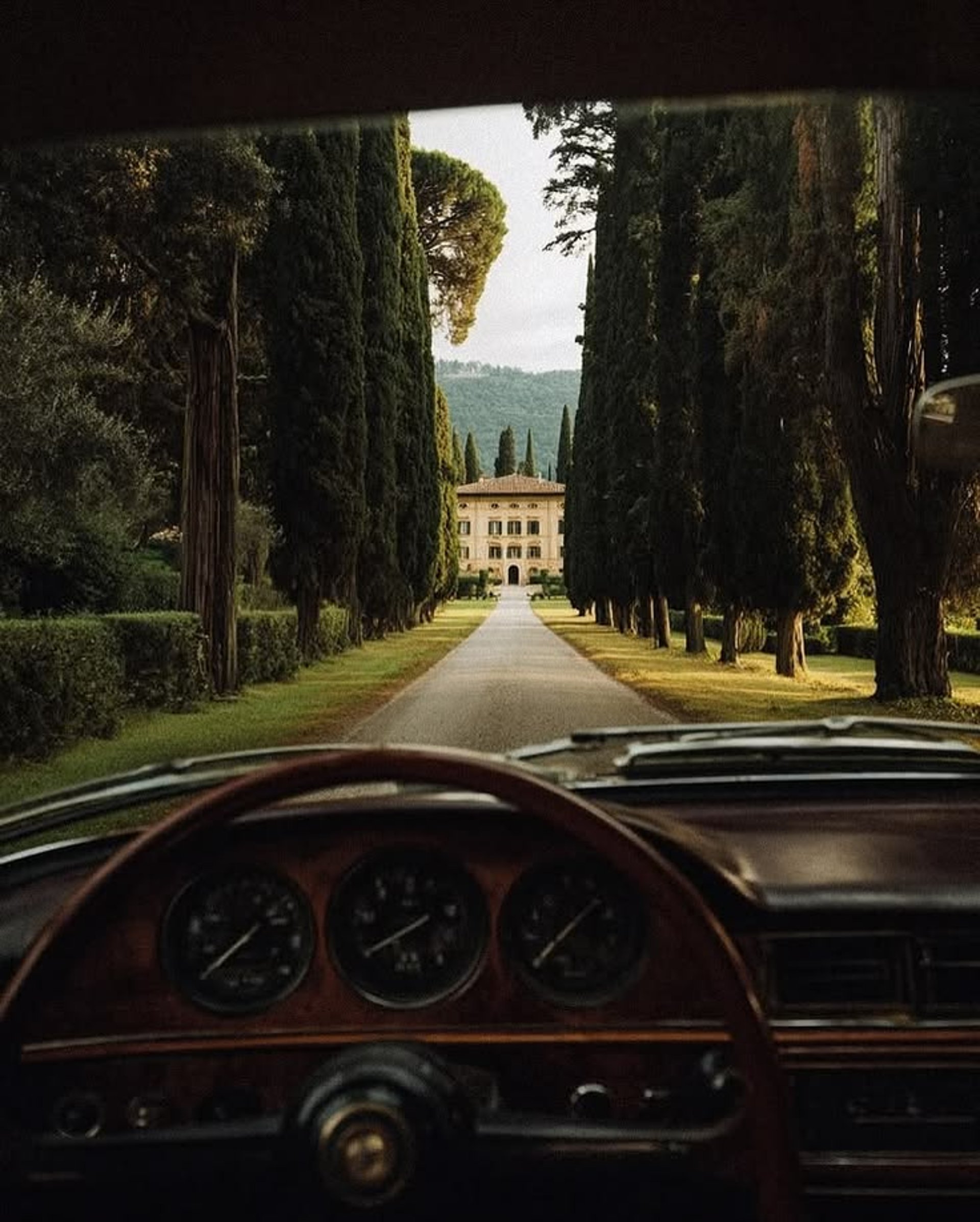 an abstract photo of a curved building with a blue sky in the background