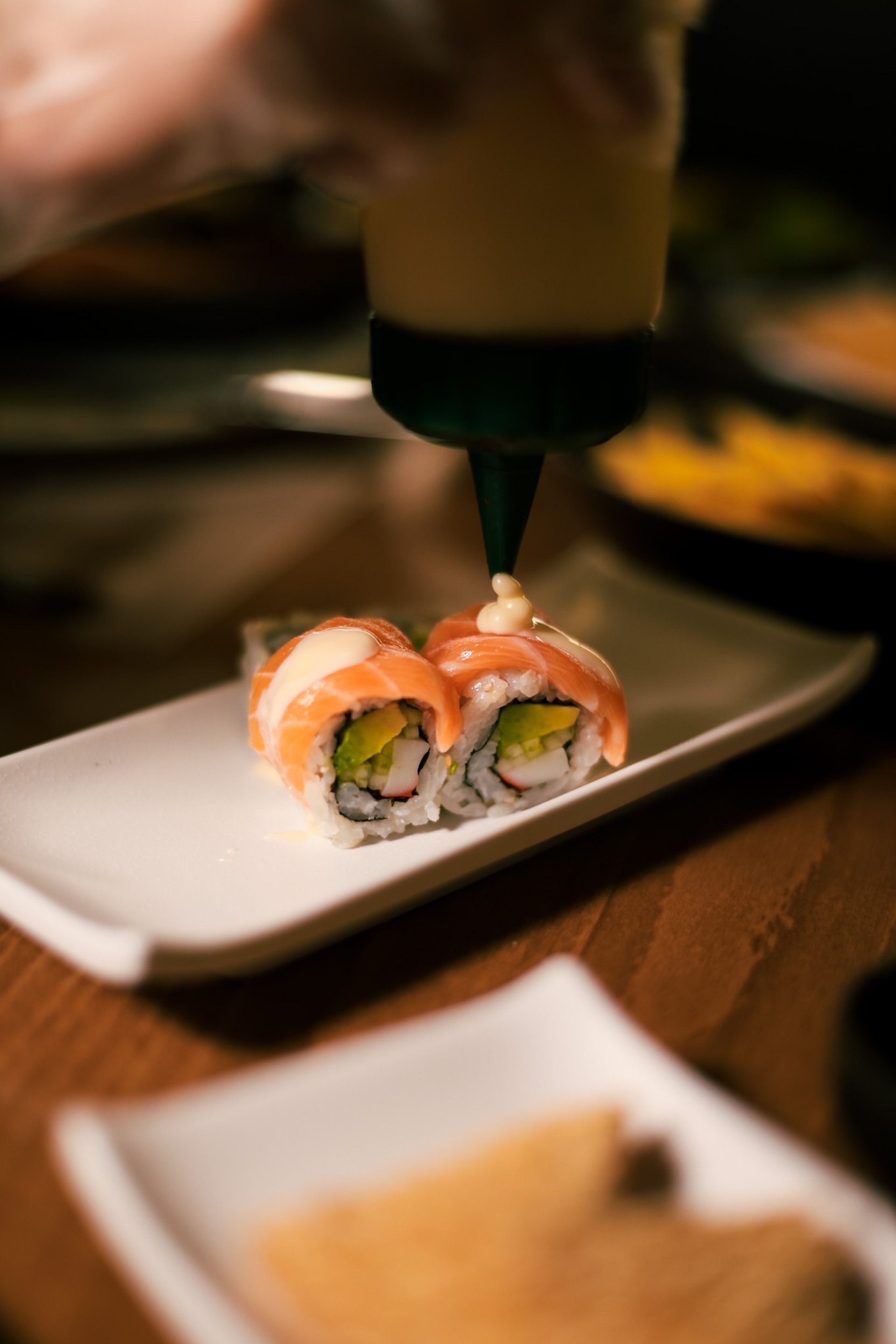 an abstract photo of a curved building with a blue sky in the background