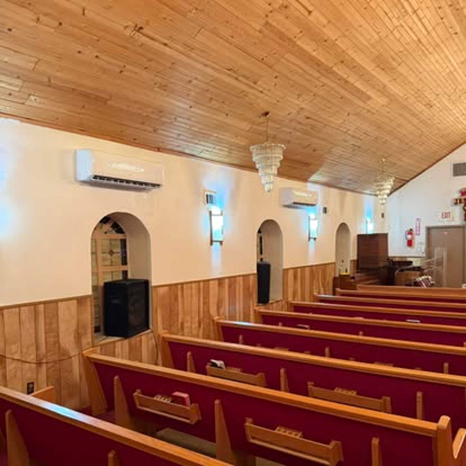 an abstract photo of a curved building with a blue sky in the background