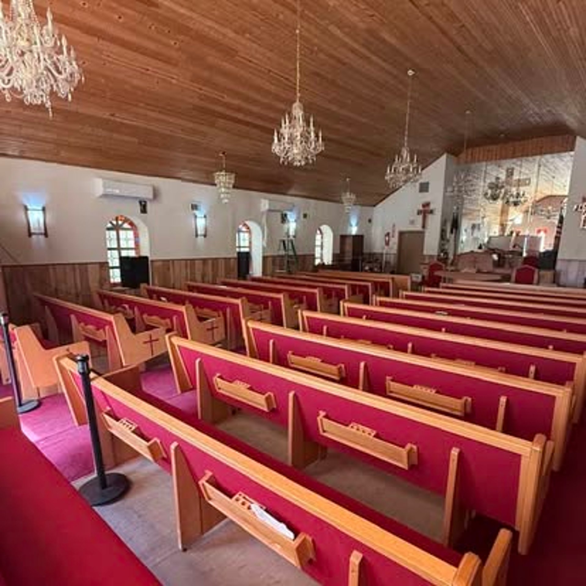 an abstract photo of a curved building with a blue sky in the background