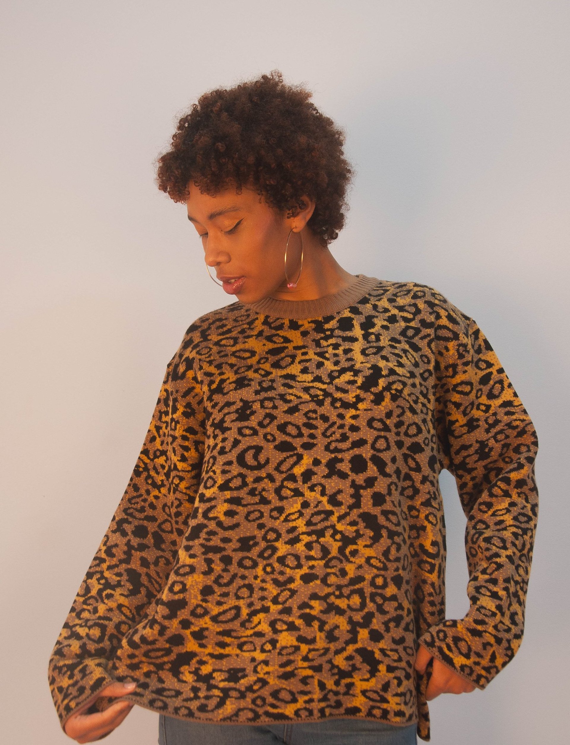 person wearing grey knit sweater