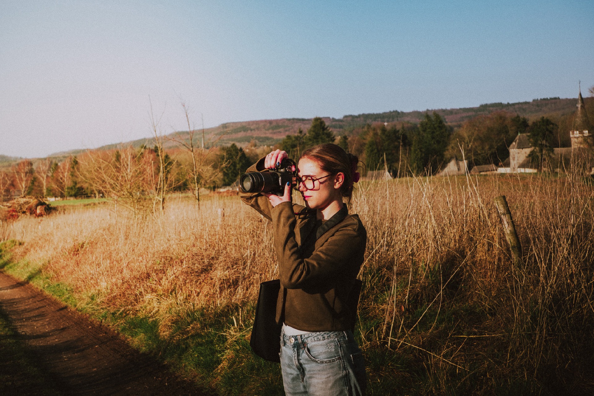 an abstract photo of a curved building with a blue sky in the background