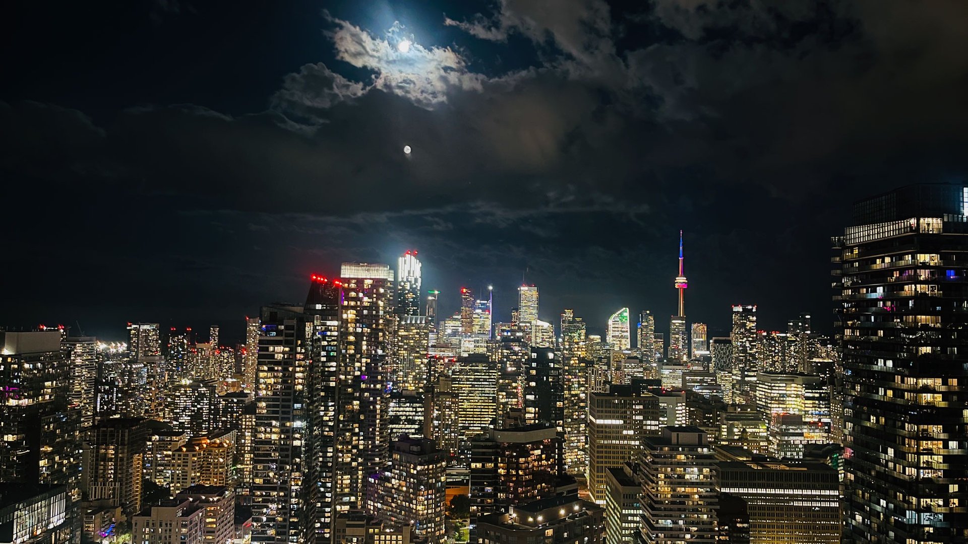 an abstract photo of a curved building with a blue sky in the background