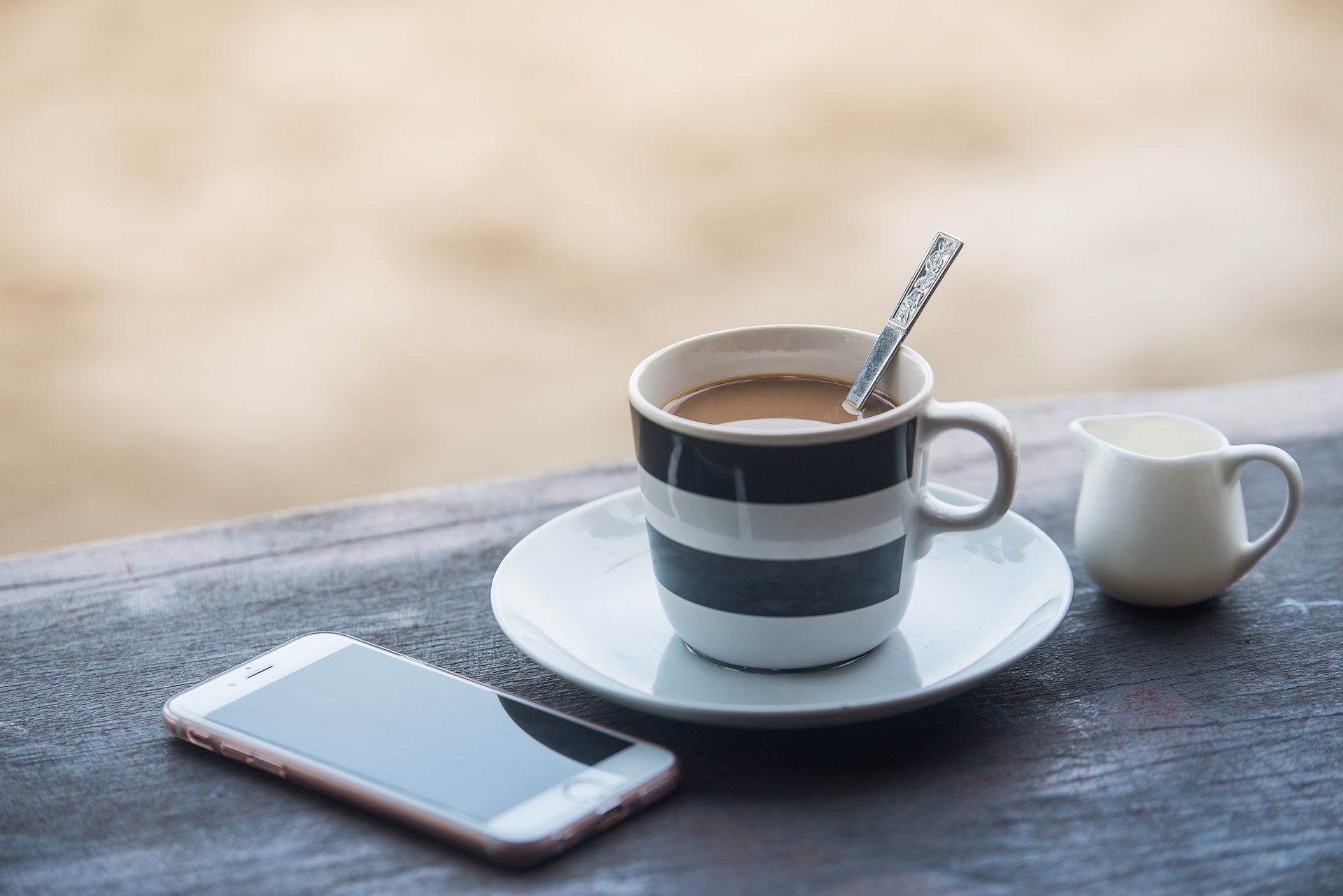 a sailboat in the ocean at sunset