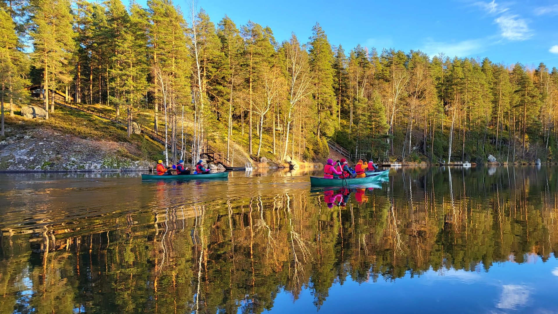an abstract photo of a curved building with a blue sky in the background
