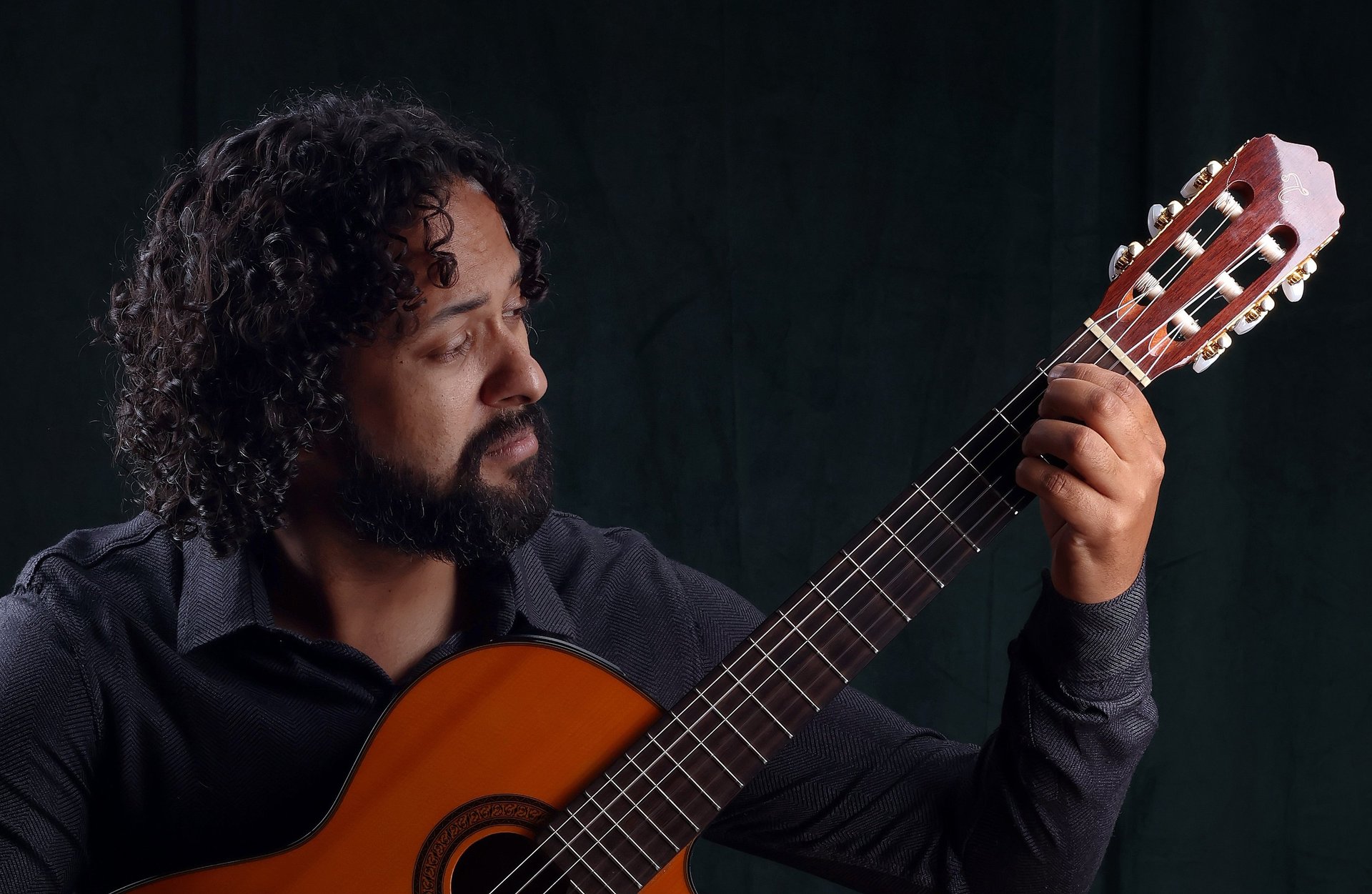 a close up of a black and brown abstract painting