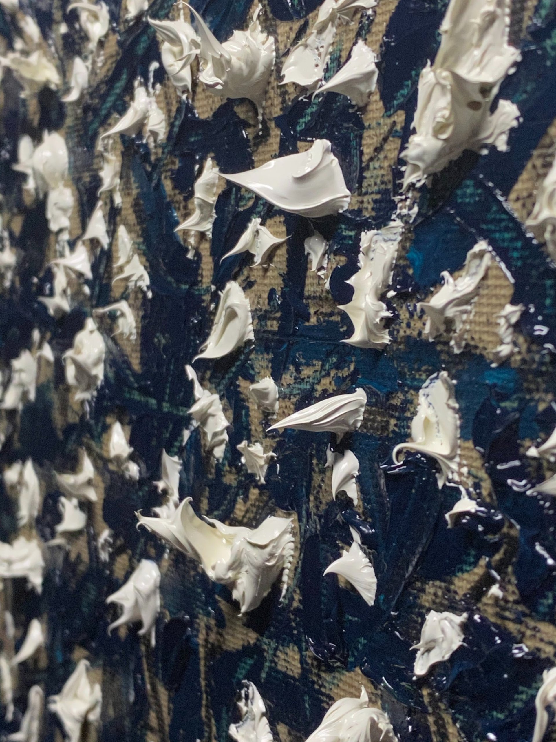 an abstract photo of a curved building with a blue sky in the background