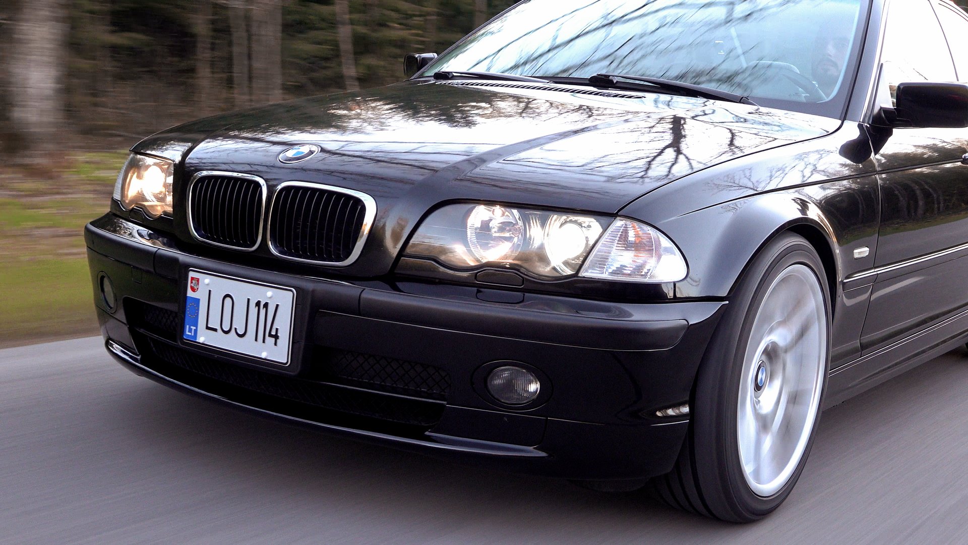A close up of a wheel on a black background