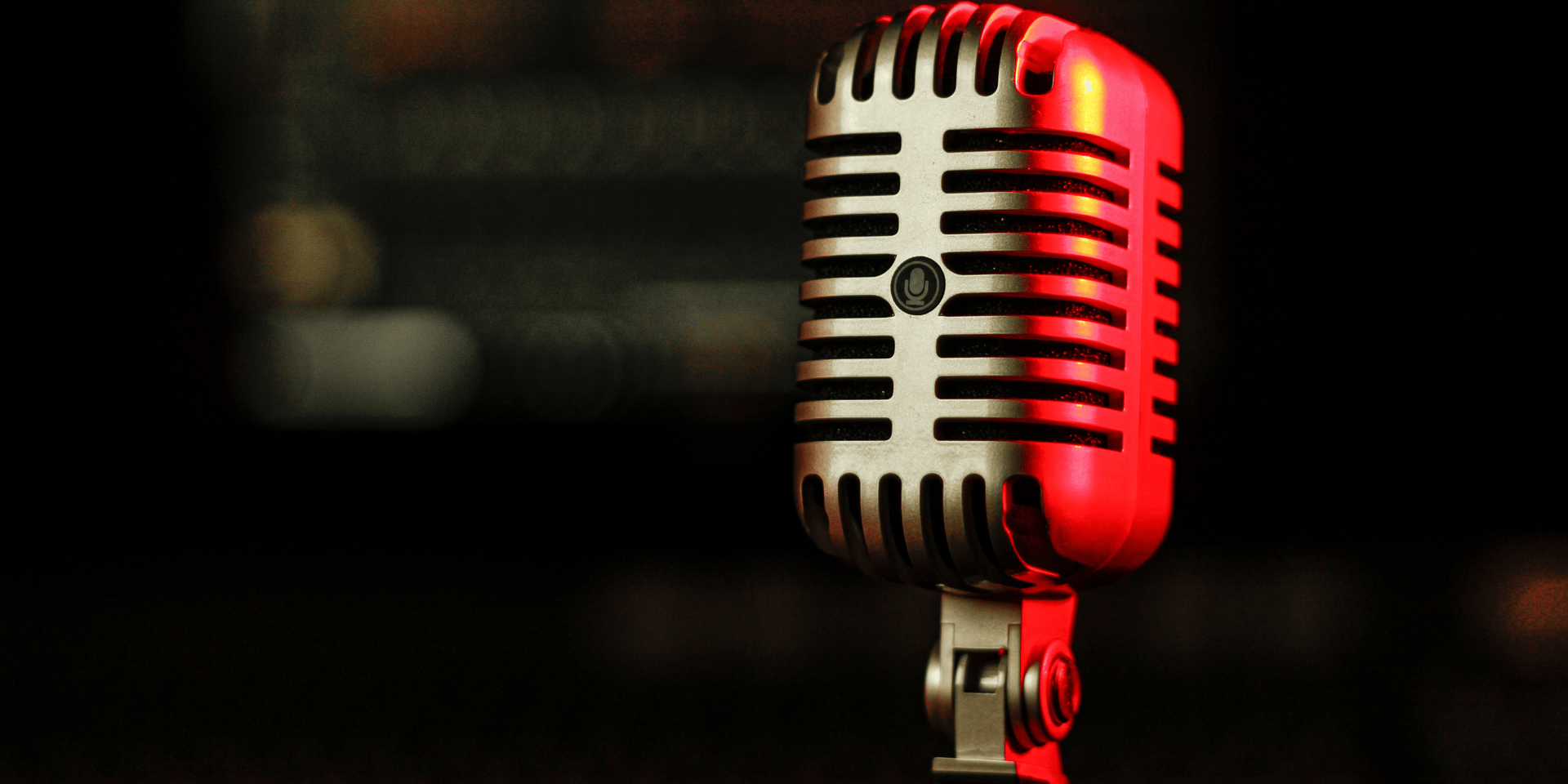 a black microphone with a blurry background